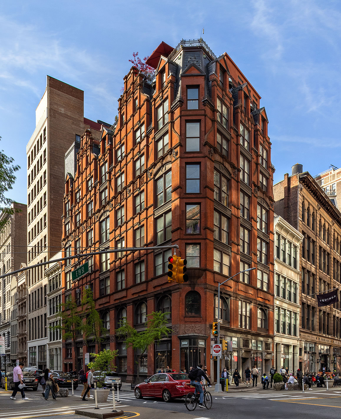 889 Broadway, Unit PHA Manhattan, NY 10003 - Photo 10 of 11 a front view of a building with lot of cars and trees