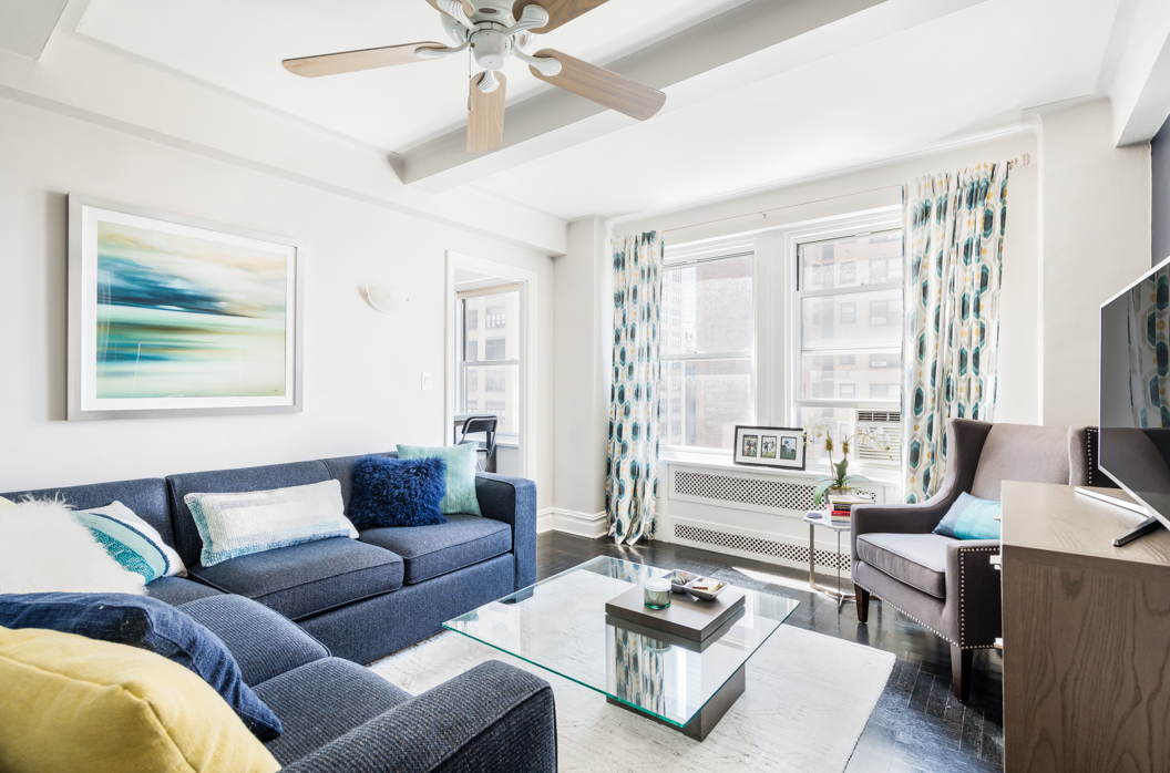 a living room with furniture and a large window