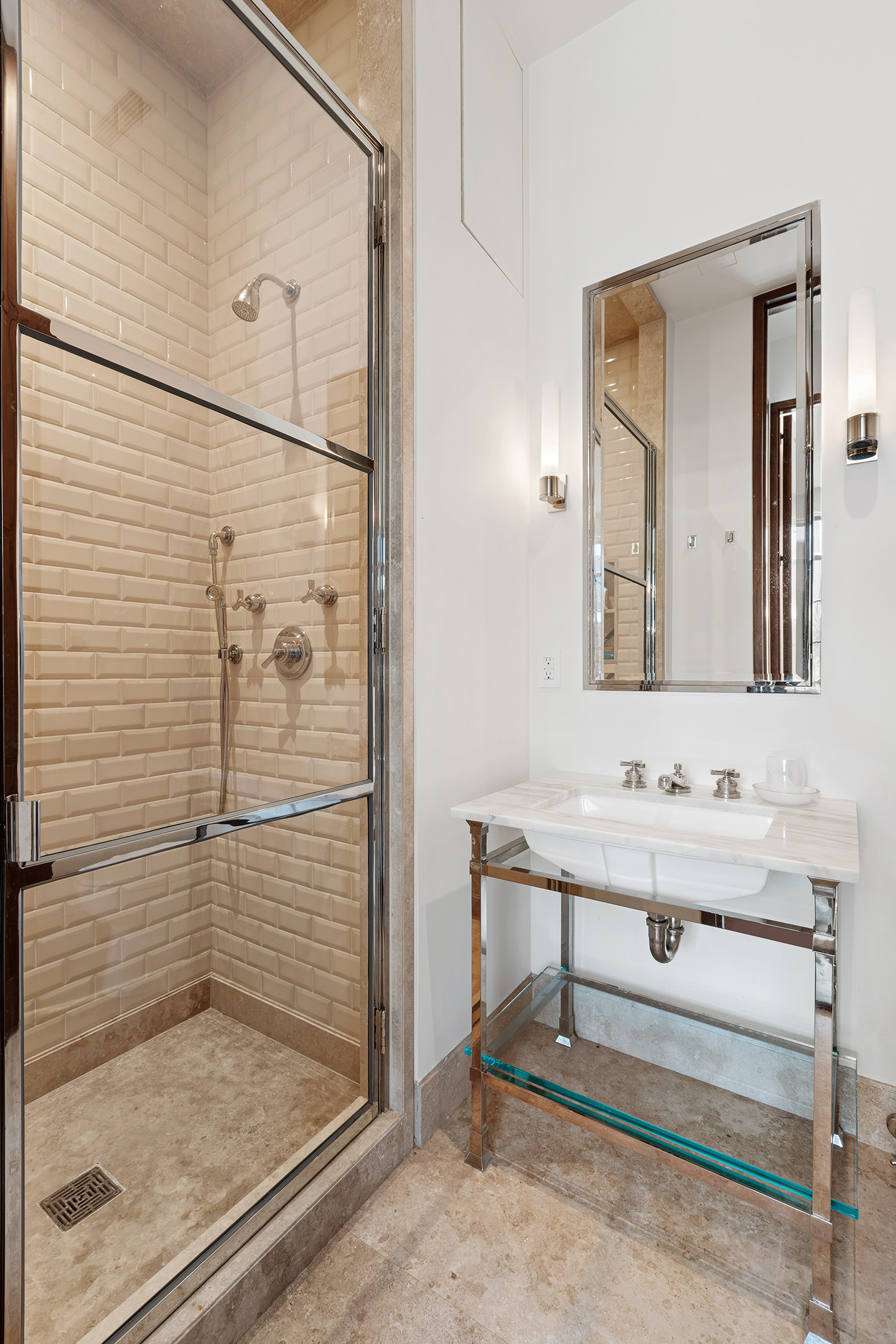 7 Hubert Street, Unit 8A Manhattan, NY 10013 - Photo 15 of 19 a bathroom with a shower sink and mirror