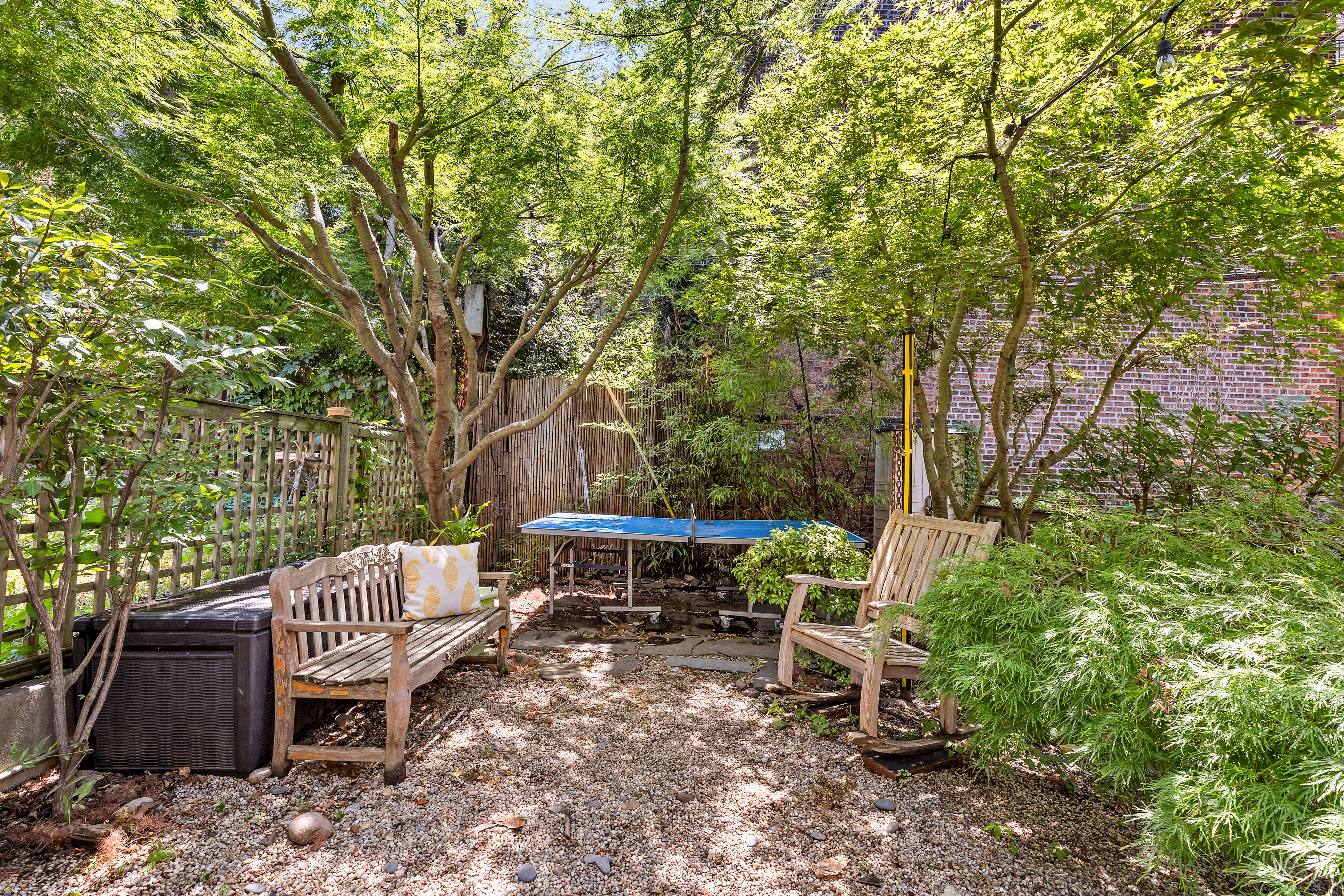 124 Carroll Street, Unit 2 Brooklyn, NY 11231 - Photo 7 of 13 a view of a wooden bench and chairs in the backyard