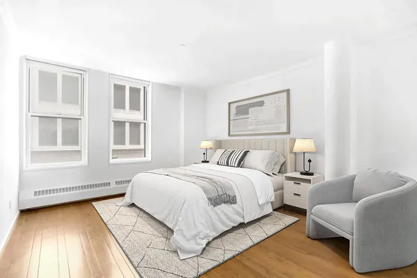 a spacious bedroom with a bed and a couch