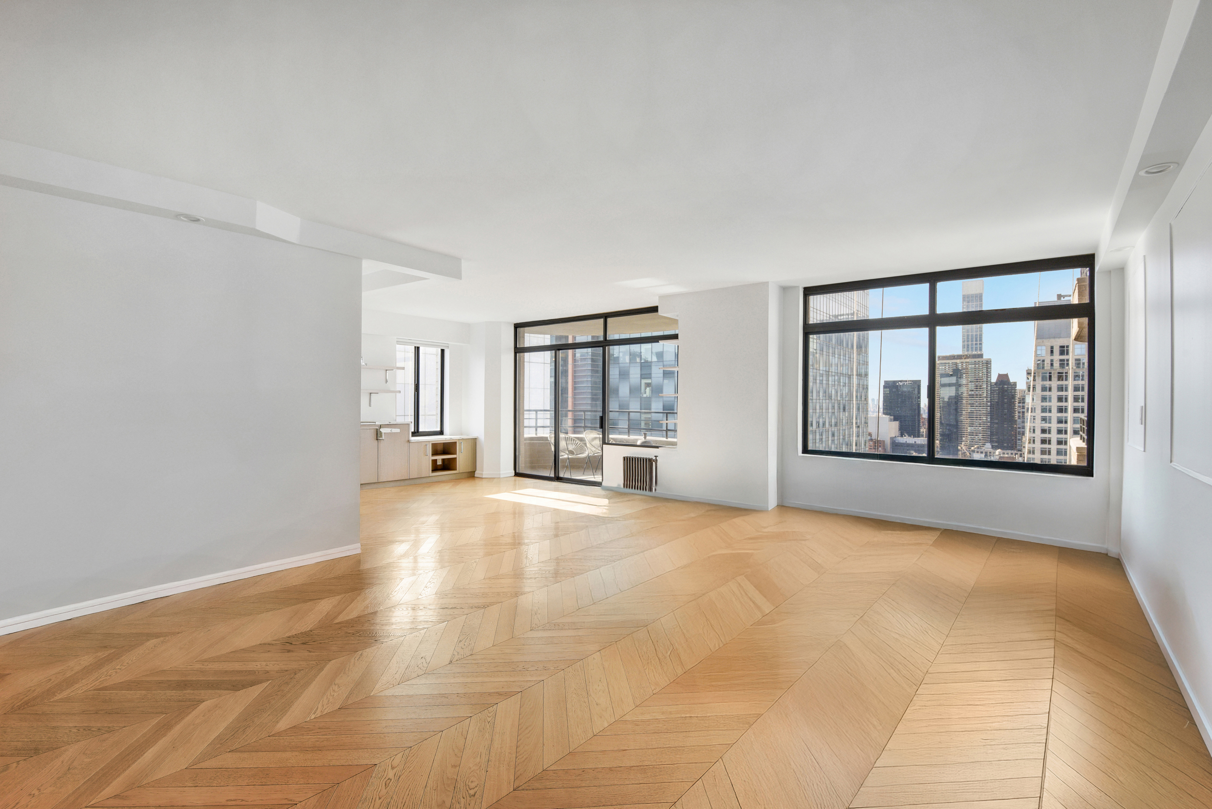 400 East 70th Street, Unit 3005 Manhattan, NY 10021 - Photo 2 of 18 a view of an empty room with a window and fireplace