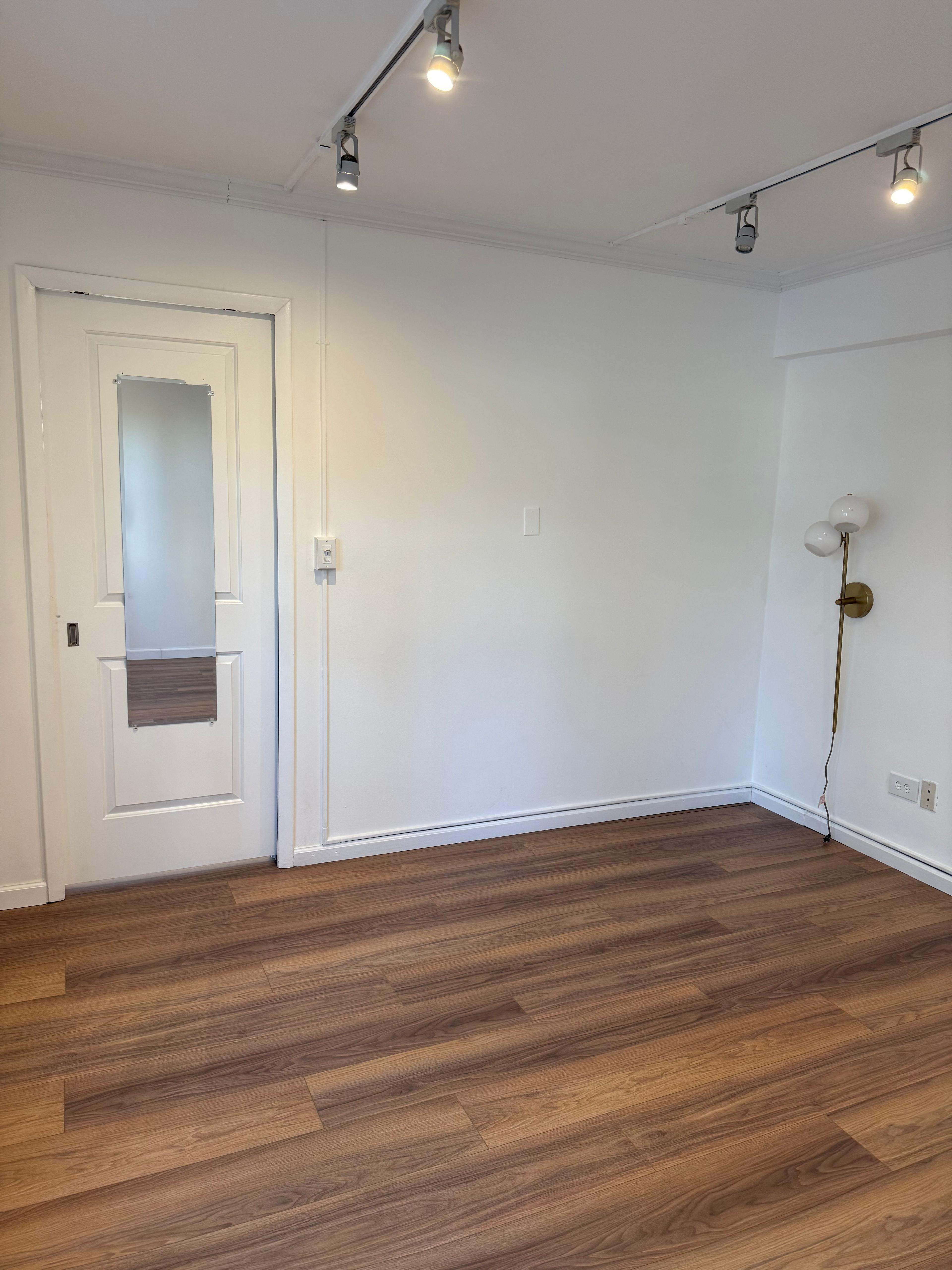 40 Sutton Place, Unit 7A Manhattan, NY 10022 - Photo 1 of 11 a view of empty room with wooden floor