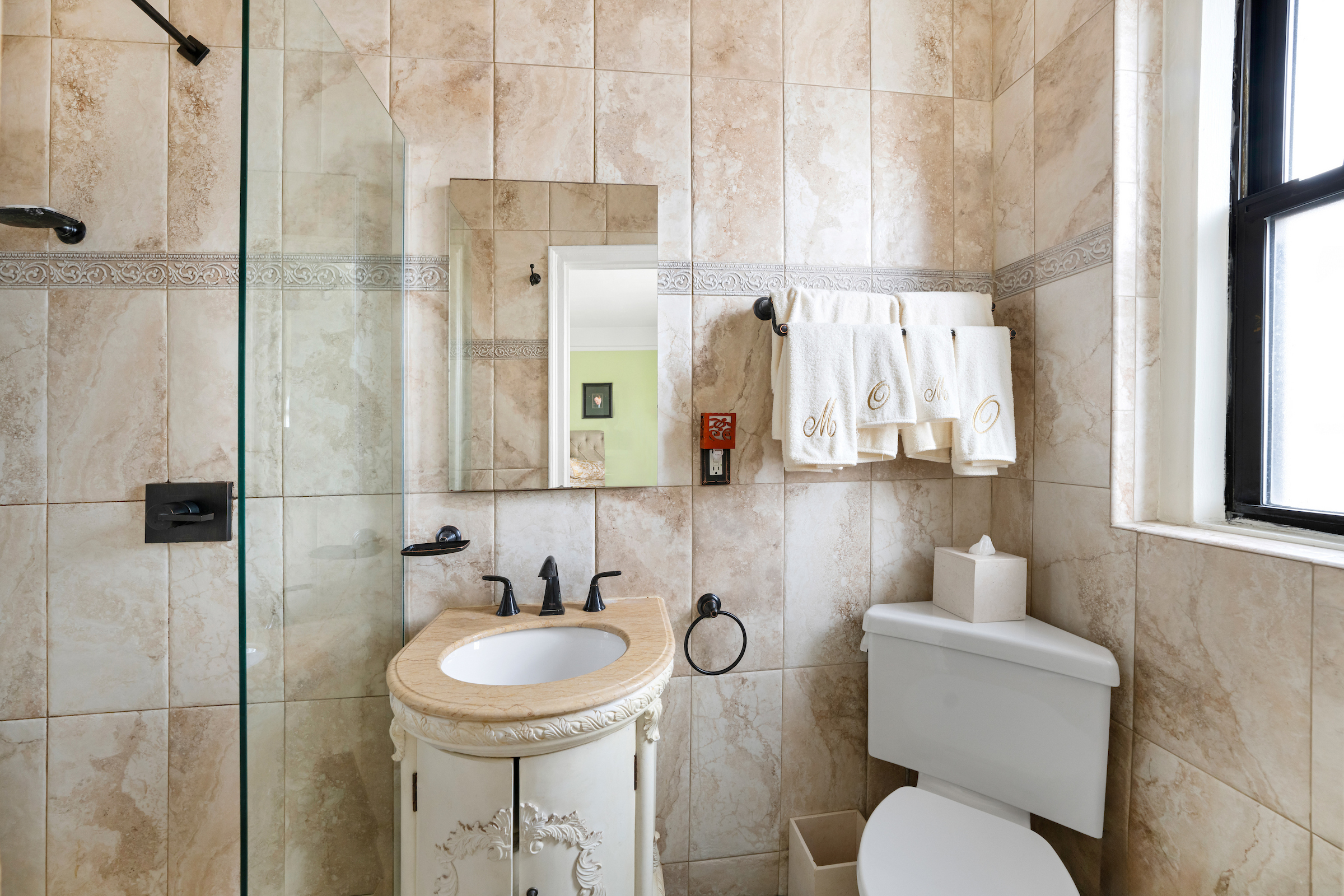 47-20 42nd Street, Unit 1H Queens, NY 11104 - Photo 8 of 11 a bathroom with a sink toilet and shower