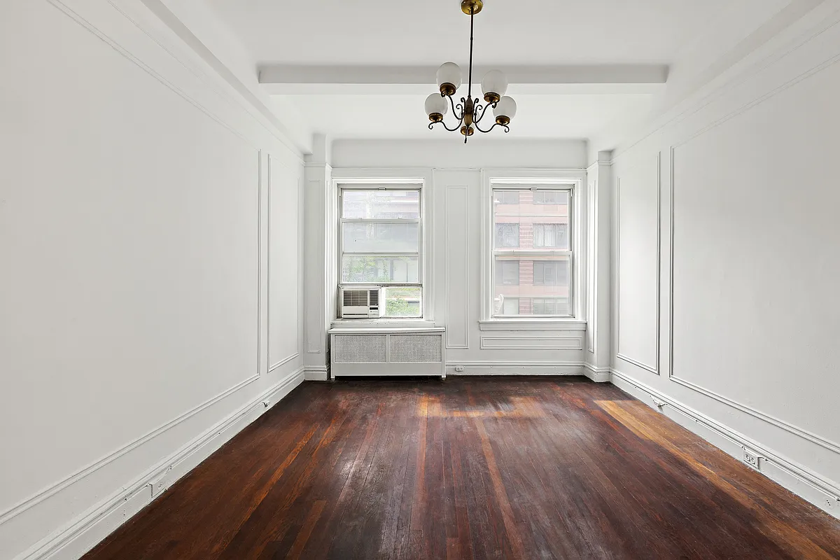 250 West 94th Street, Unit 5D Manhattan, NY 10025 - Photo 13 of 17 a view of livingroom with hardwood floor and window