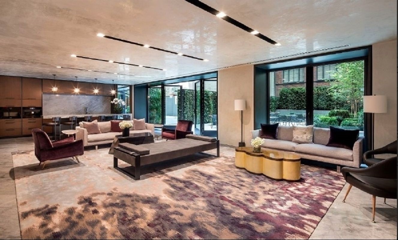 70 Charlton Street, Unit 7E Manhattan, NY 10014 - Photo 14 of 17 a living room with furniture and a large window