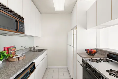 a bathroom with a sink toilet and a mirror