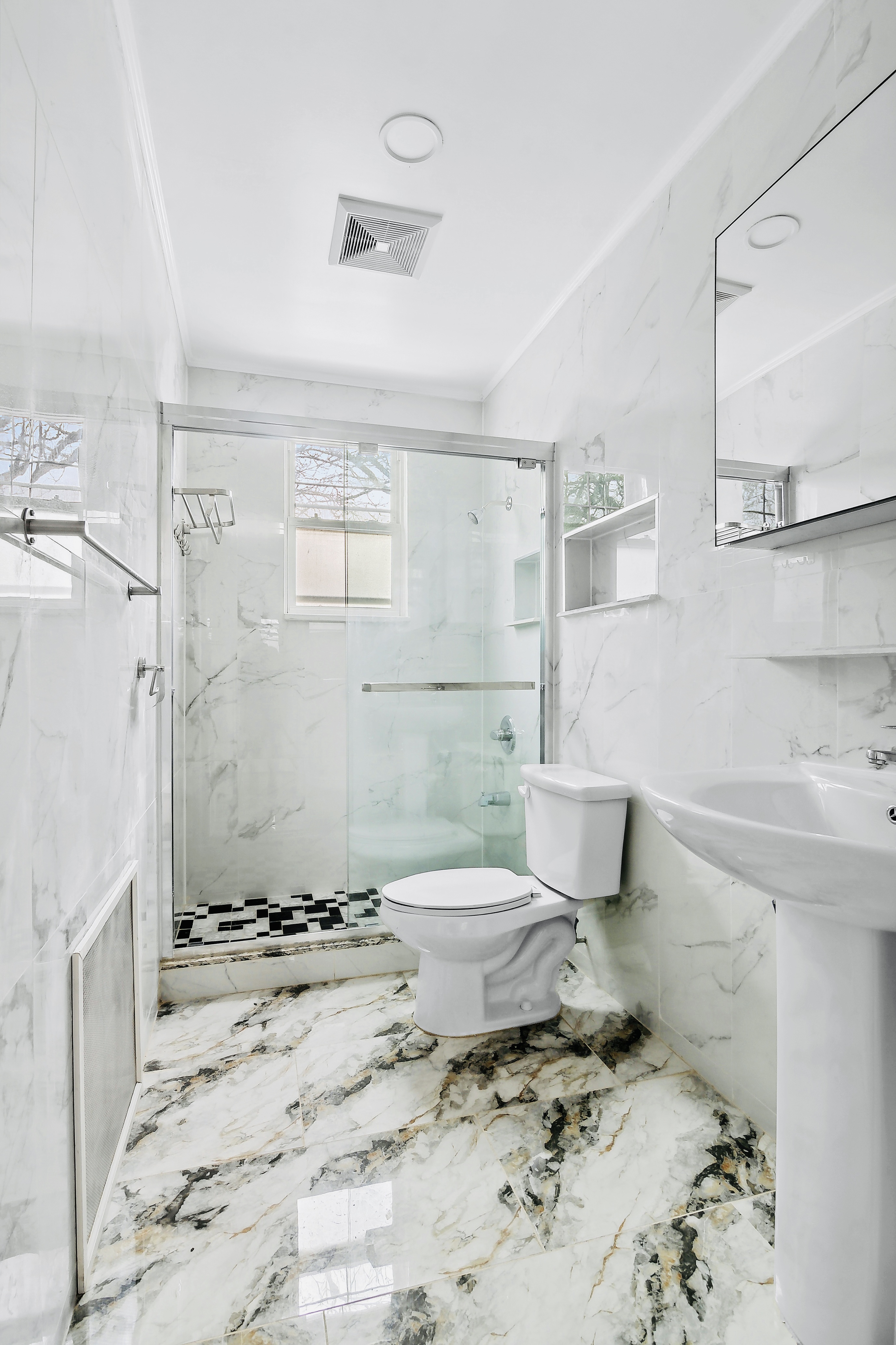 63-33 Haring Street, Unit 2F Queens, NY 11374 - Photo 7 of 7 a bathroom with a sink toilet and shower