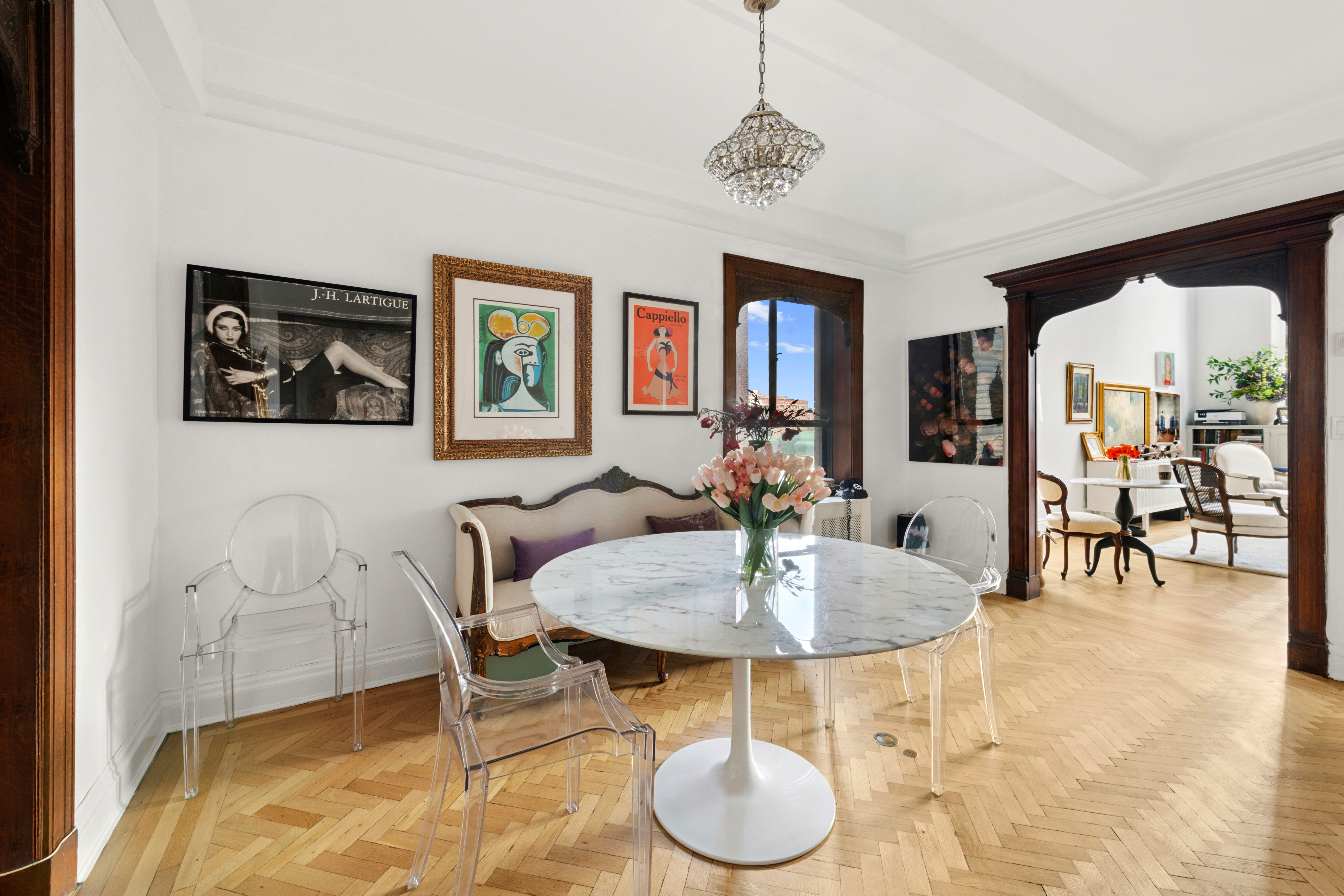 1 West 67th Street, Unit 608 Manhattan, NY 10023 - Photo 5 of 16 a living room with furniture and a table