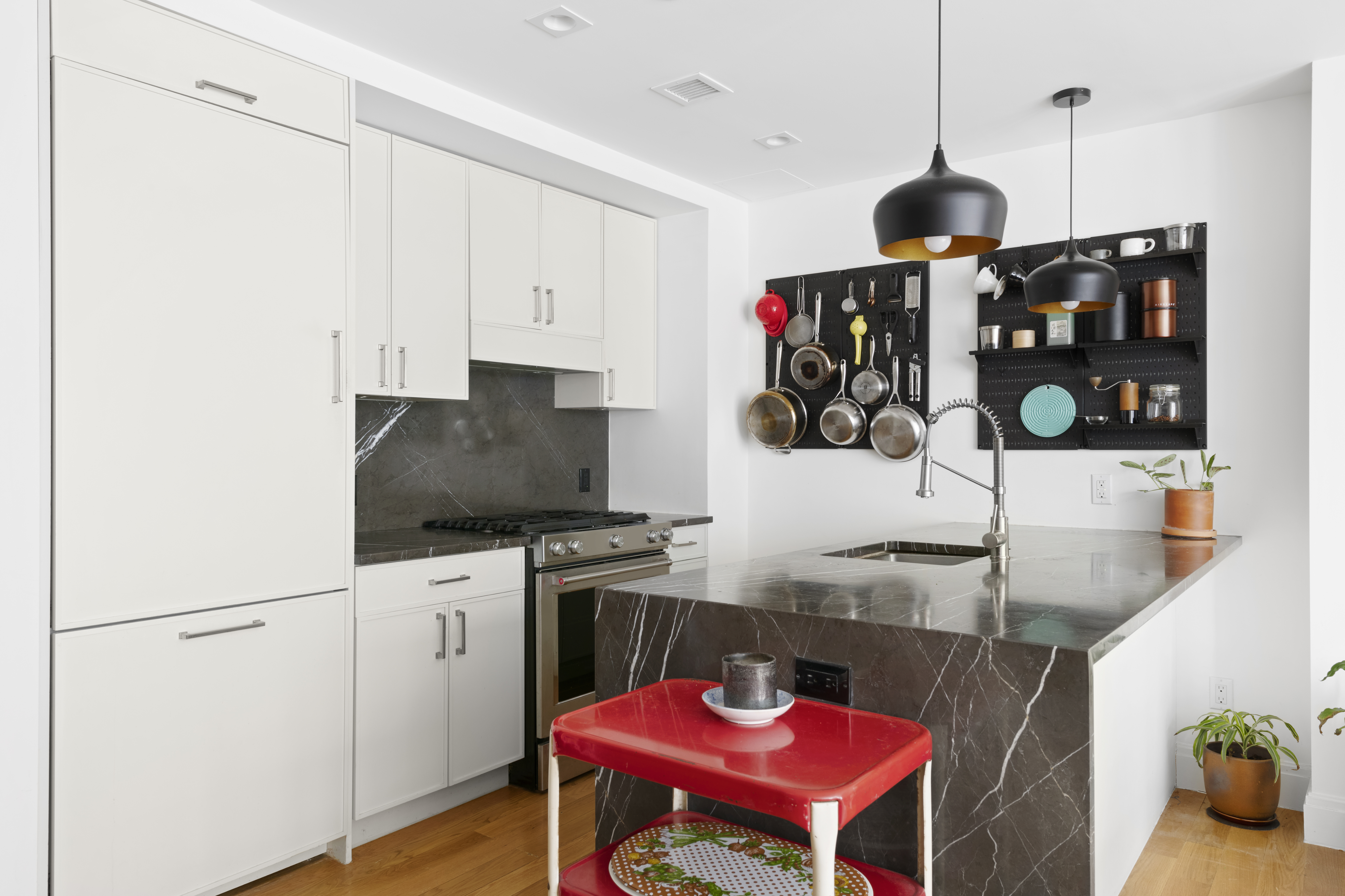 554 4th Avenue, Unit 3A Brooklyn, NY 11215 - Photo 5 of 11 a kitchen with stainless steel appliances granite countertop a sink a stove and a wooden floors