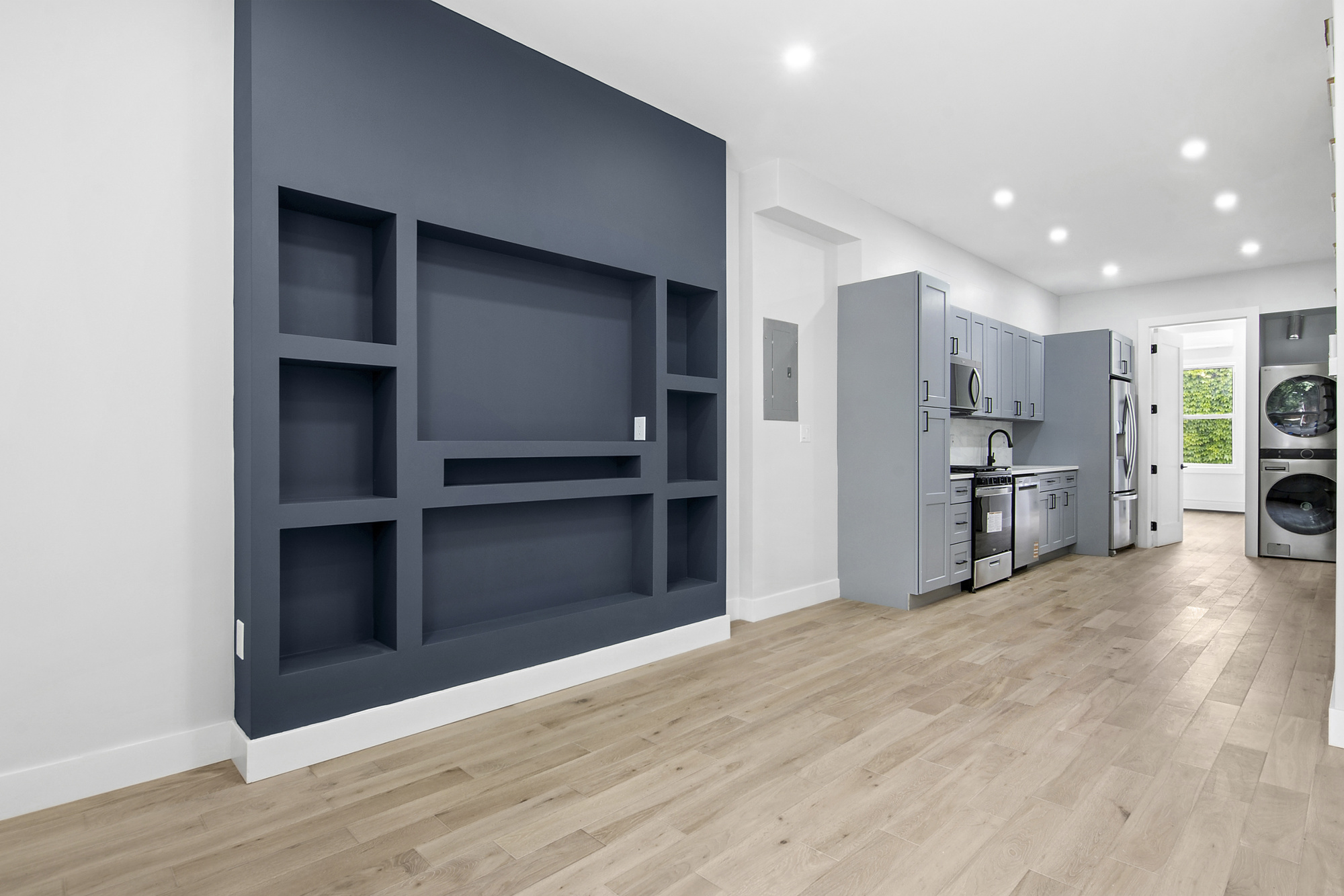 41-05 20th Avenue Queens, NY 11105 - Photo 4 of 20 a view of a kitchen with refrigerator and wooden floor