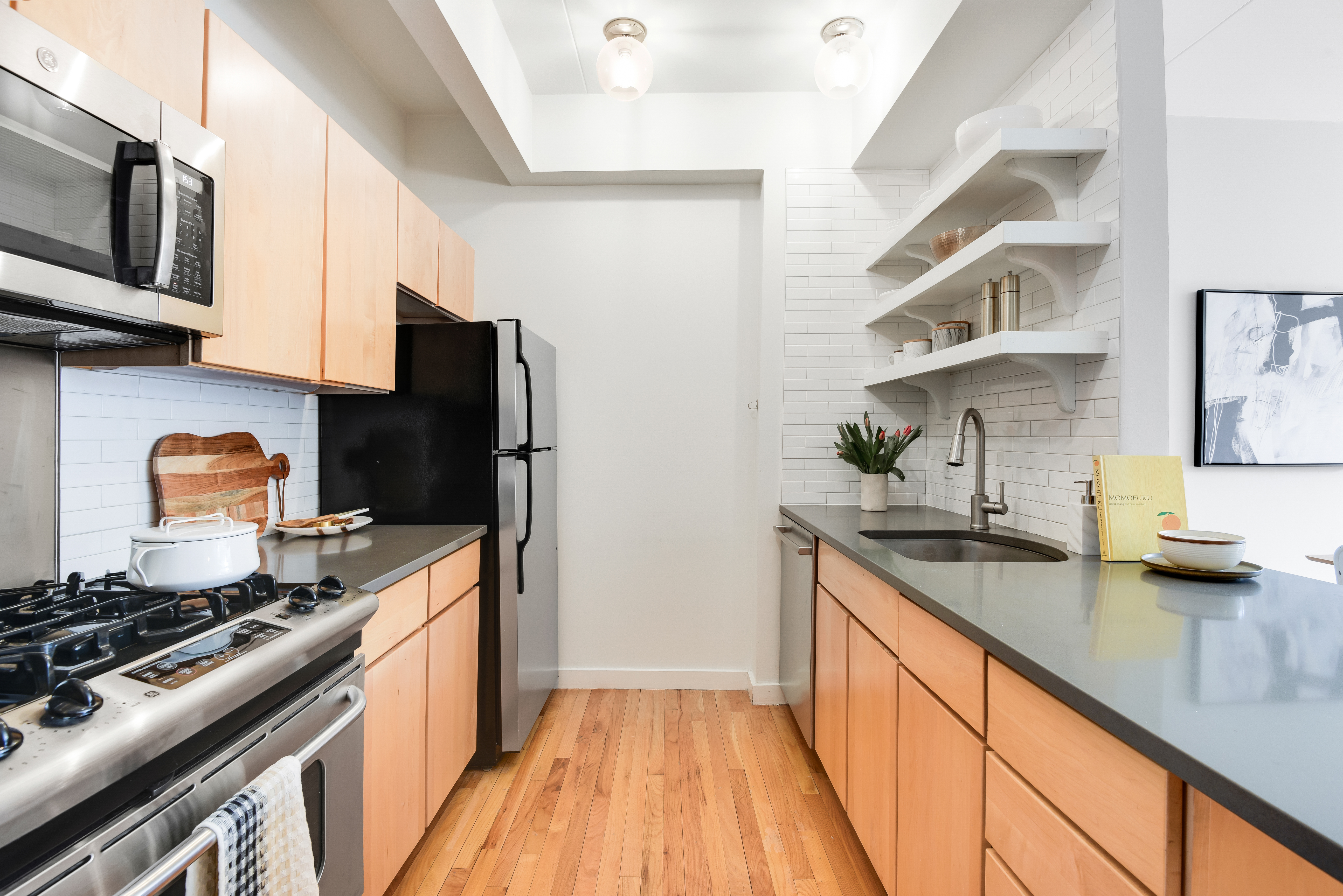 475 Sterling Place, Unit 3A Brooklyn, NY 11238 - Photo 8 of 23 a kitchen with stainless steel appliances granite countertop a sink stove and refrigerator