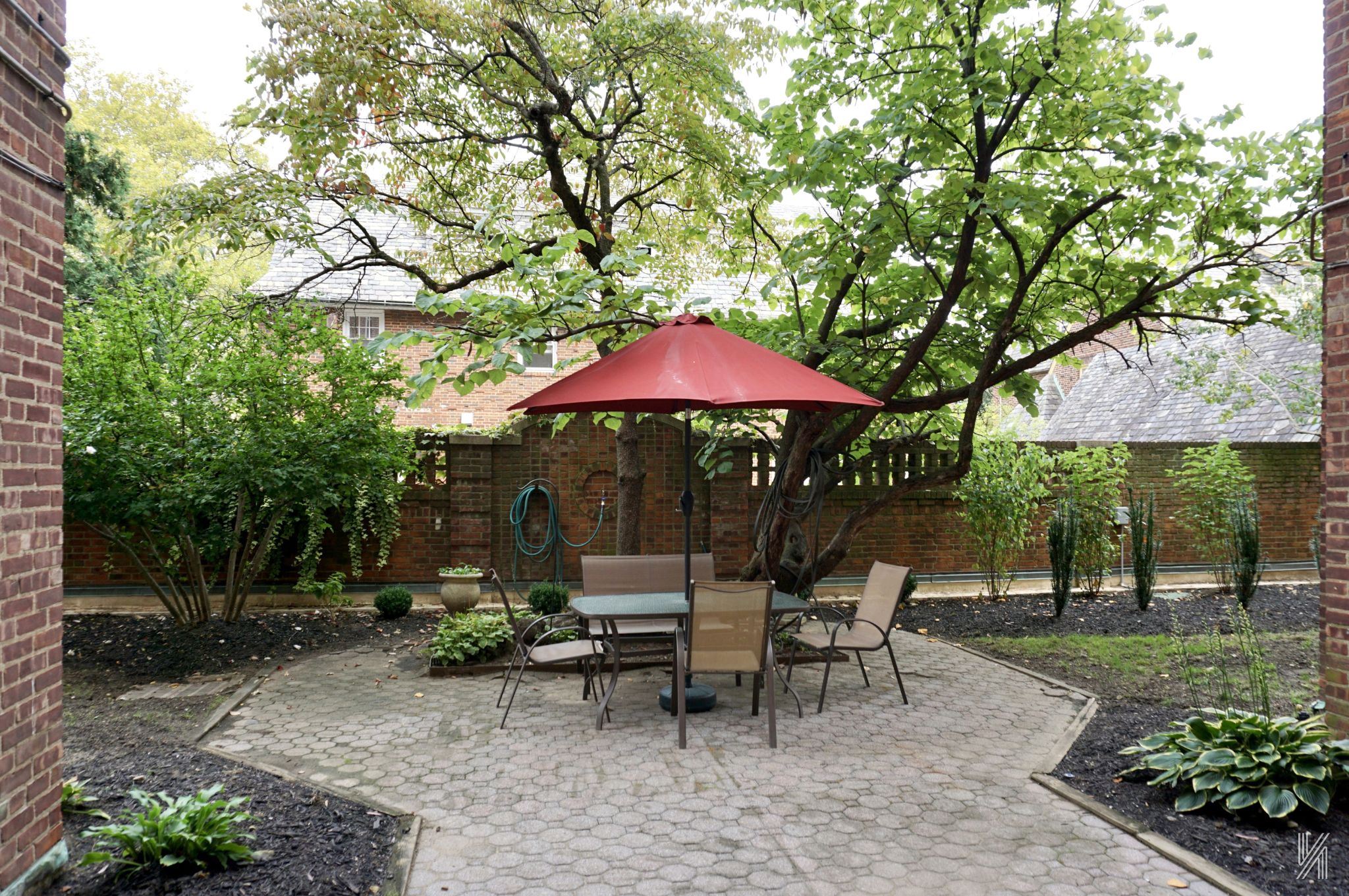 34-41 85th Street, Unit 1X Queens, NY 11372 - Photo 16 of 24 a view of backyard with outdoor seating and trees