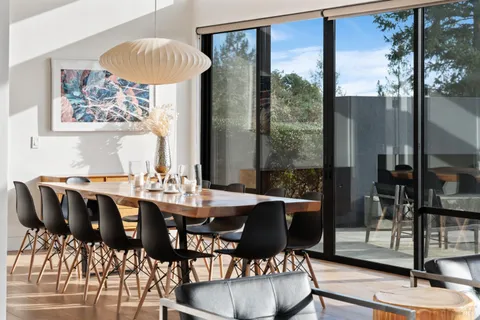 a view of a dining room with furniture window and outside view