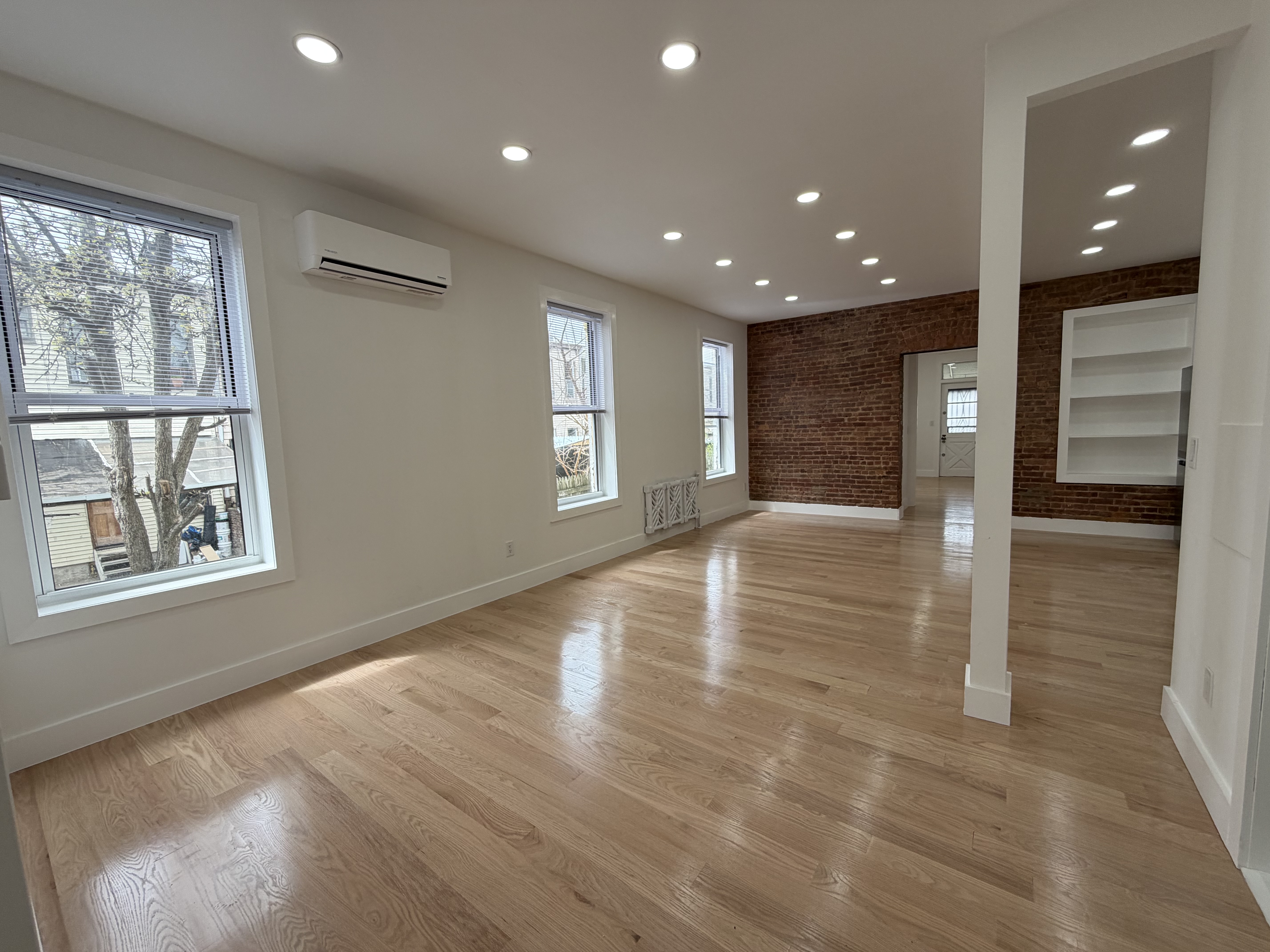 18-61 Dekalb Avenue, Unit 1 Queens, NY 11385 - Photo 3 of 12 a view of a livingroom with a window