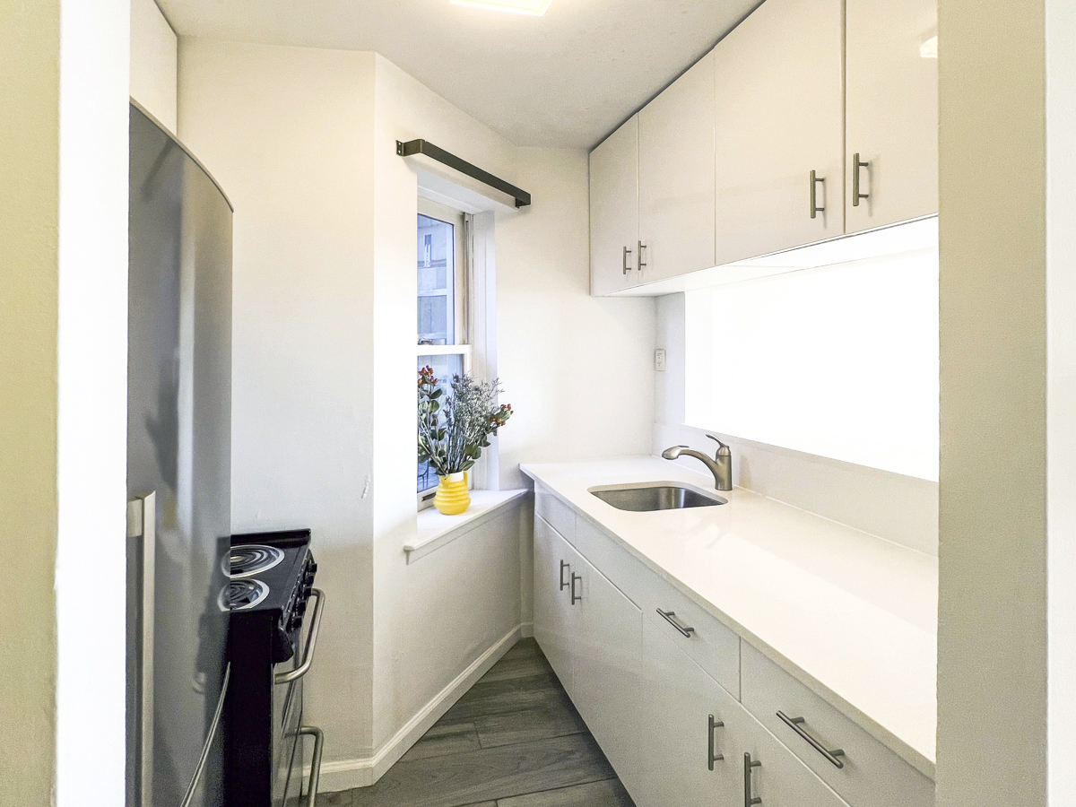 335 West 21st Street, Unit 4FE Manhattan, NY 10011 - Photo 5 of 11 a bathroom with a sink and a mirror
