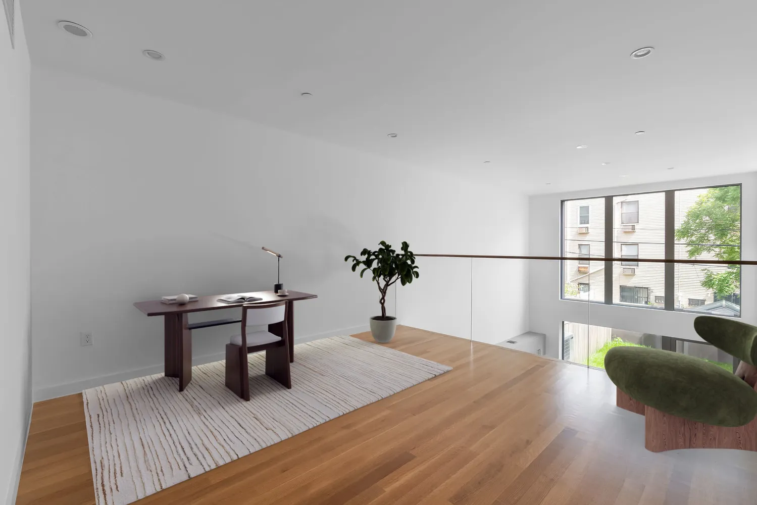 a bedroom with furniture and a wooden floor