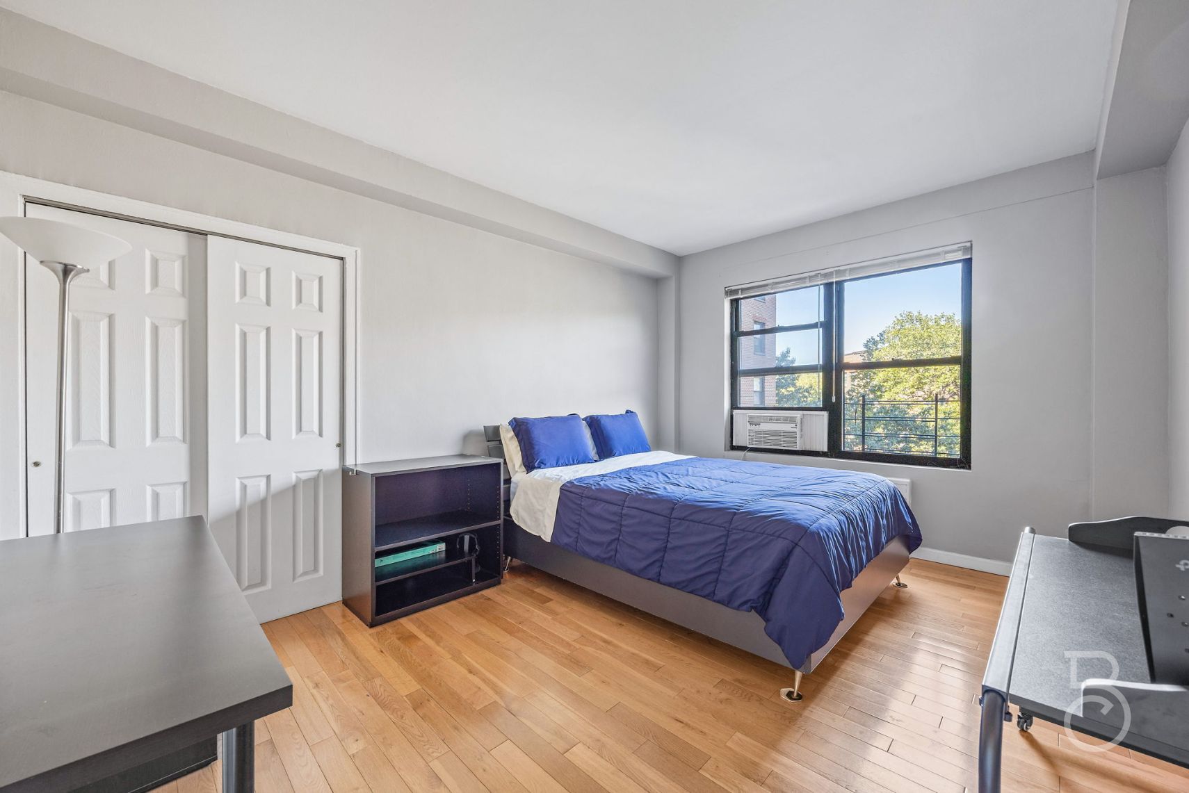 99-52 66th Road, Unit 5D Queens, NY 11374 - Photo 5 of 13 a bedroom with a bed and a window