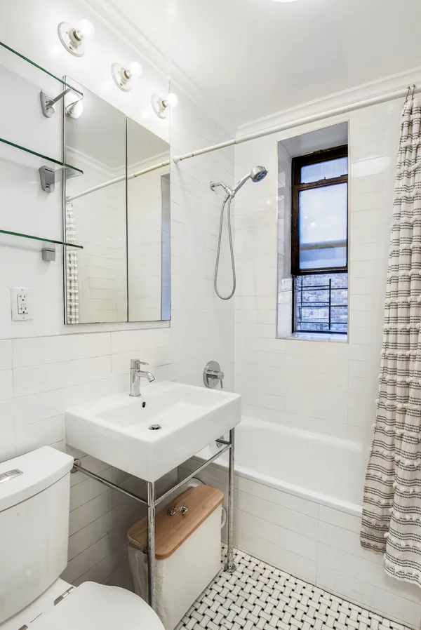 a bathroom with a sink a toilet and a bathtub
