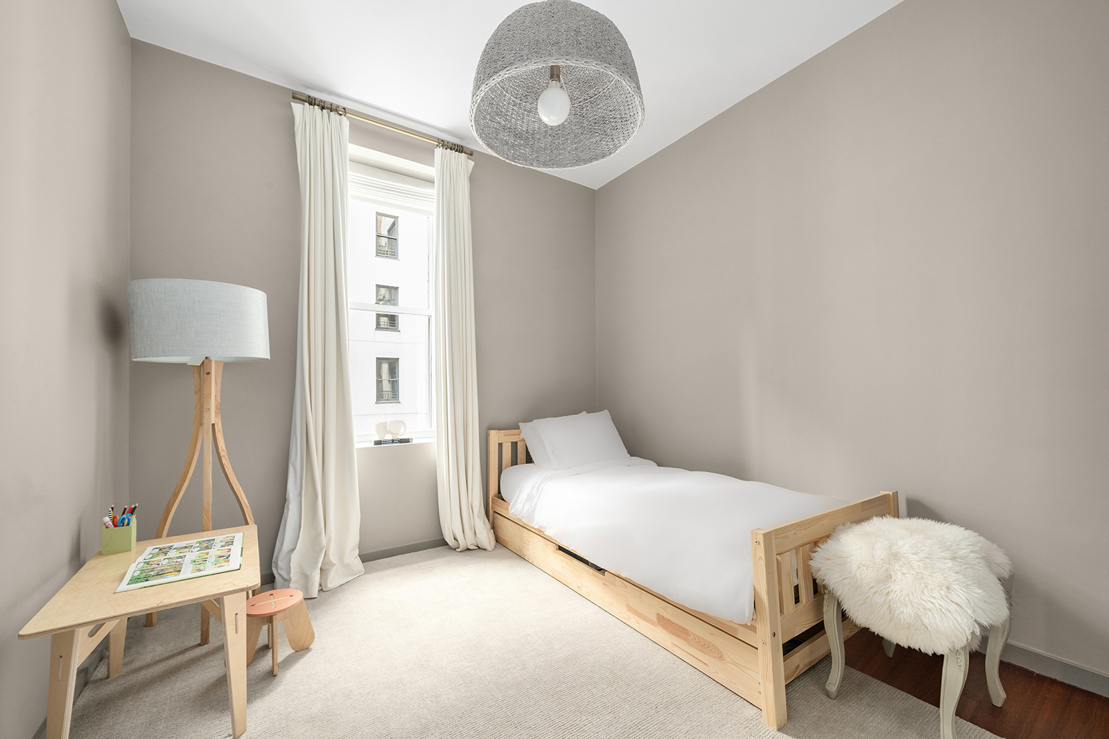 39 North Moore Street, Unit 4A Manhattan, NY 10013 - Photo 11 of 17 a bedroom with a bed and a table