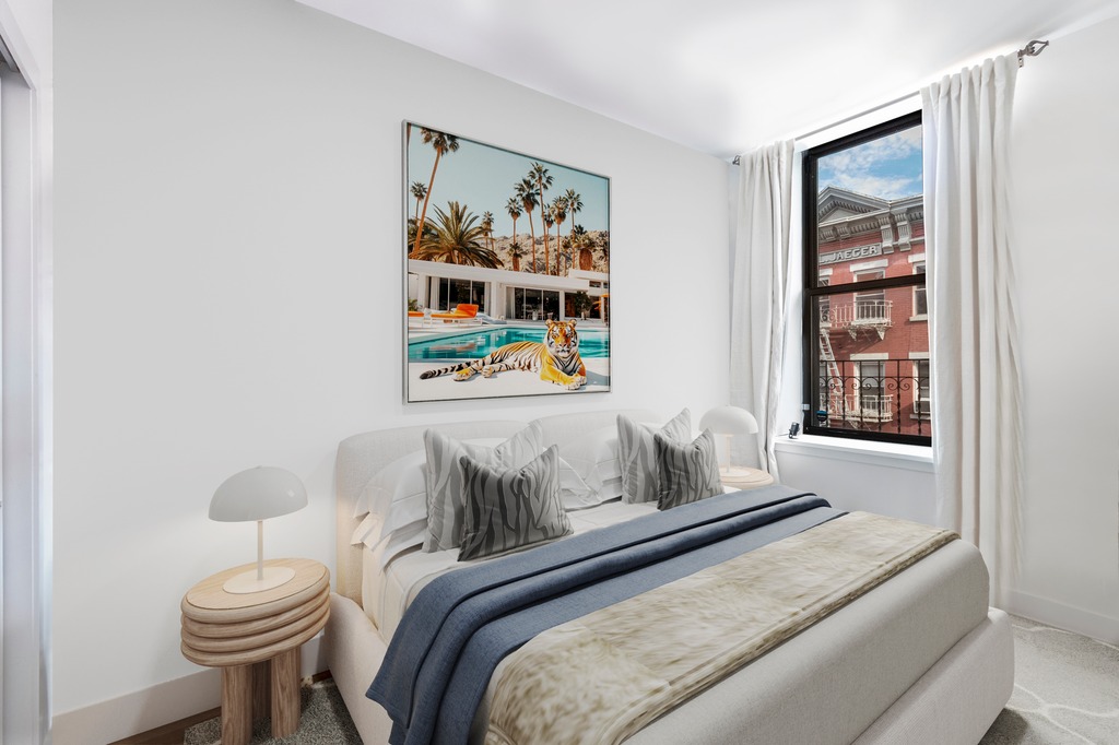 133 Mulberry Street, Unit 5A Manhattan, NY 10013 - Photo 6 of 15 a bedroom with a bed and painting on the wall