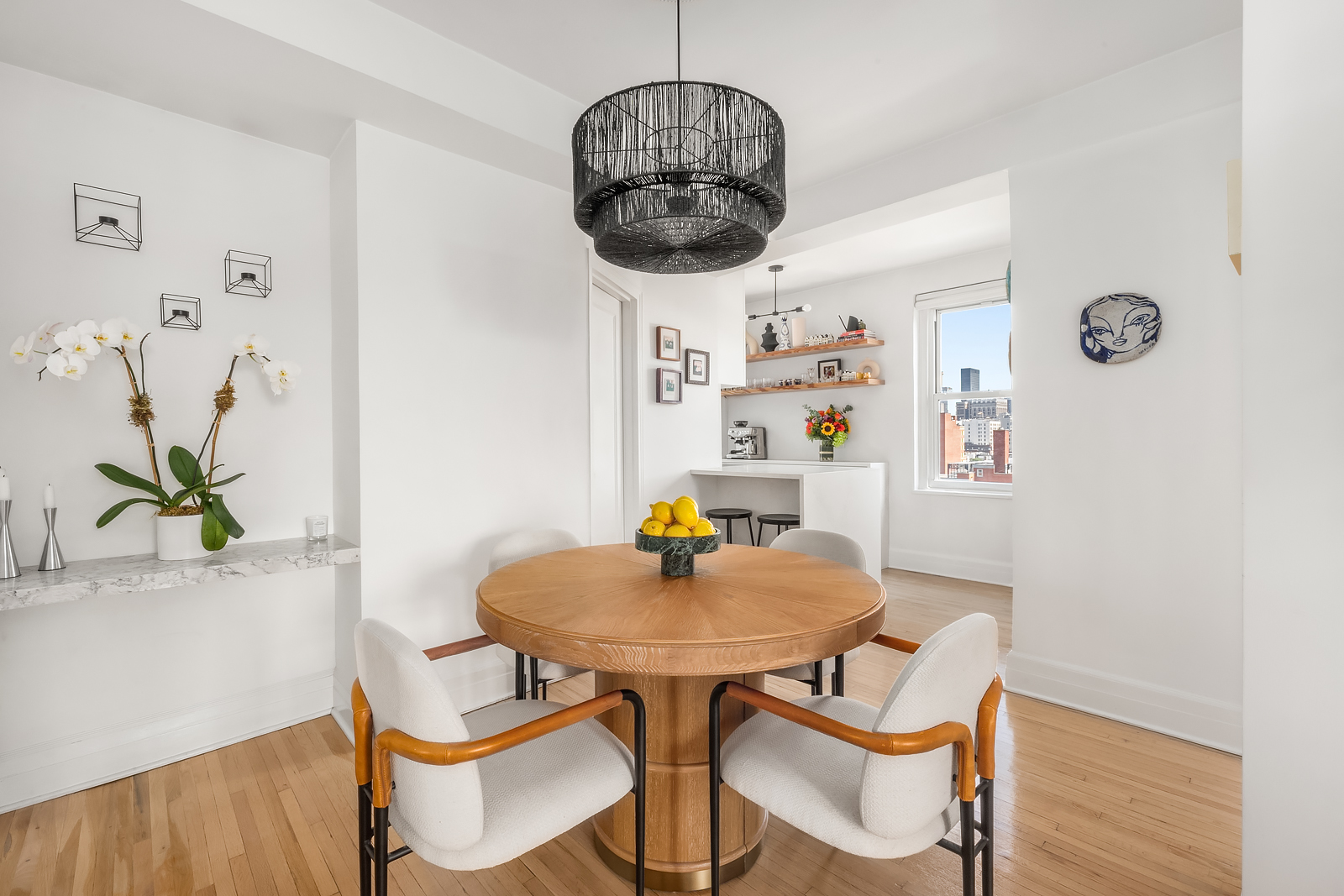 365 West 20th Street, Unit 14B Manhattan, NY 10011 - Photo 7 of 21 a view of a dining room with furniture and wooden floor
