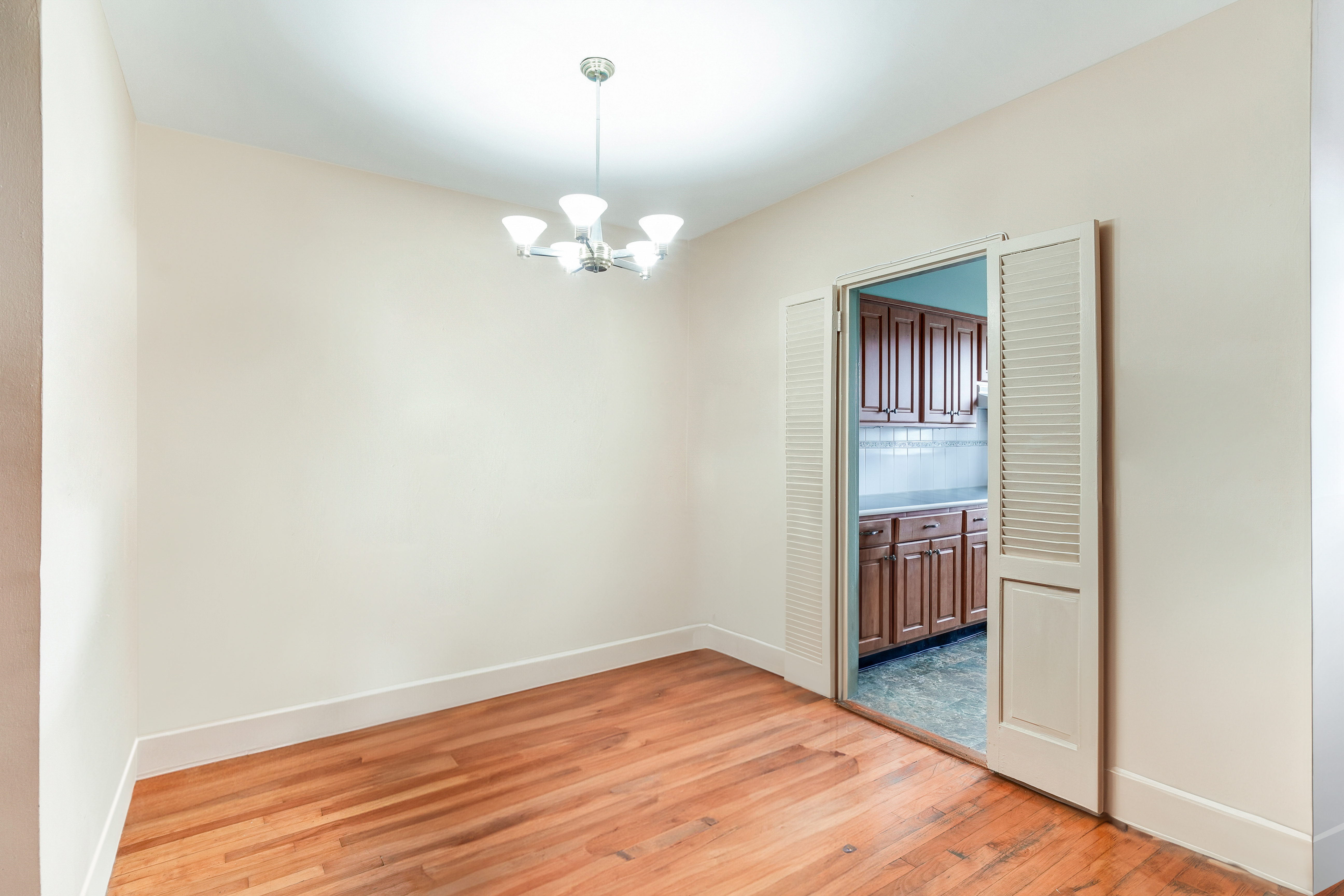 9801 Shore Road, Unit 3E Brooklyn, NY 11209 - Photo 4 of 9 a view of empty room with wooden floor