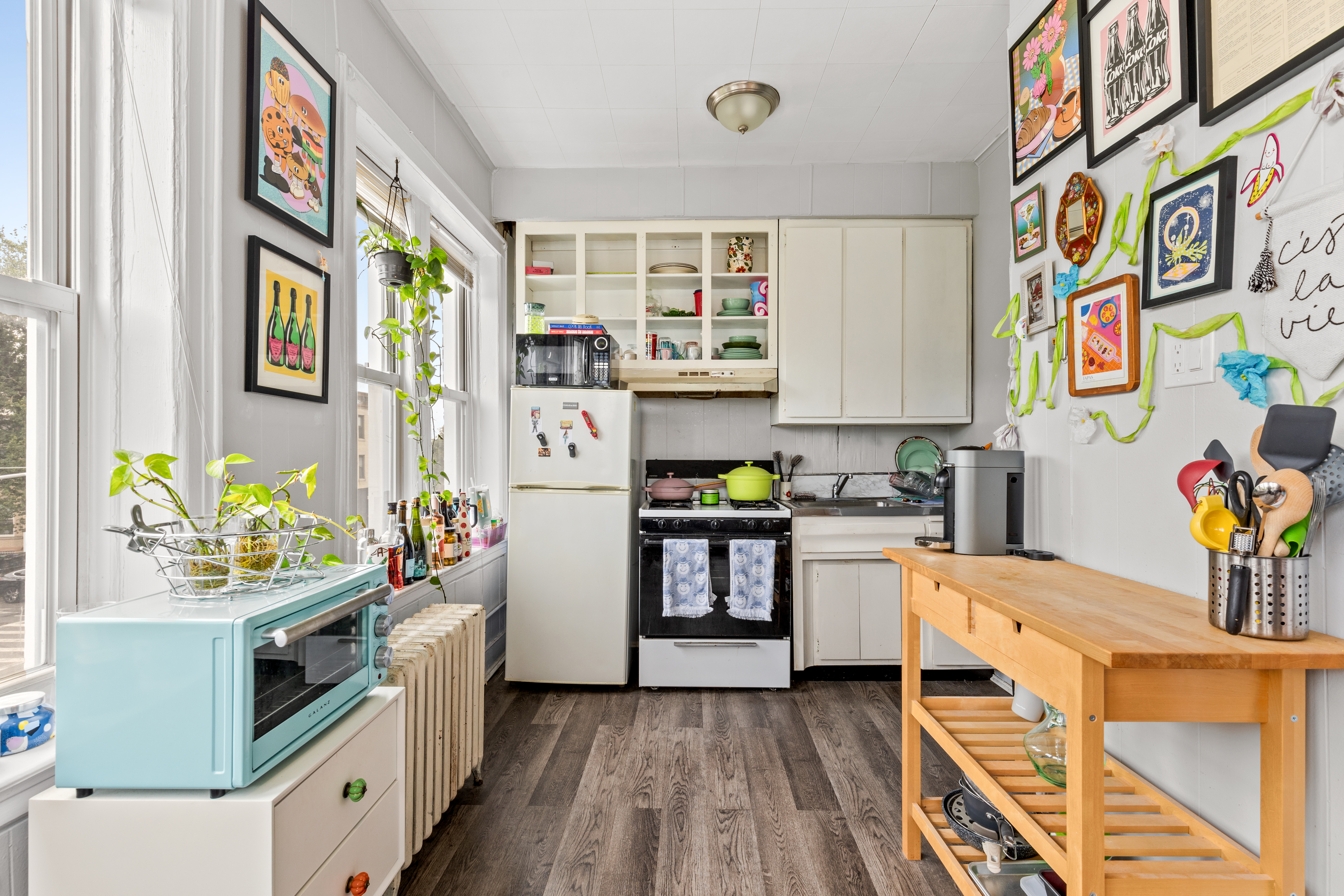 546 Prospect Avenue, Unit 2F Brooklyn, NY 11215 - Photo 3 of 4 a kitchen with stainless steel appliances a stove a sink and a refrigerator