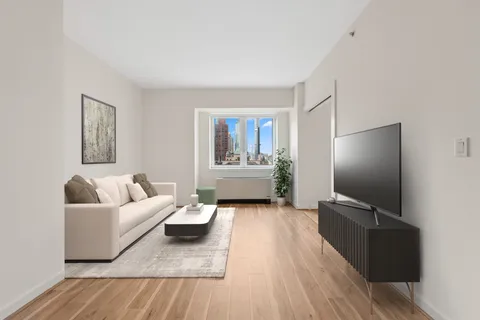a view of an empty room and wooden floor