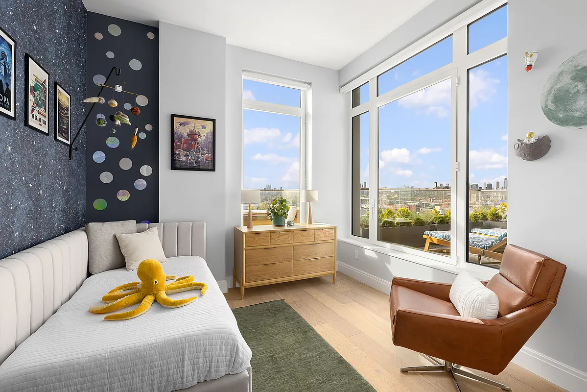 181 18th Street, Unit 1002 Brooklyn, NY 11215 - Photo 7 of 19 a living room with furniture and a large window