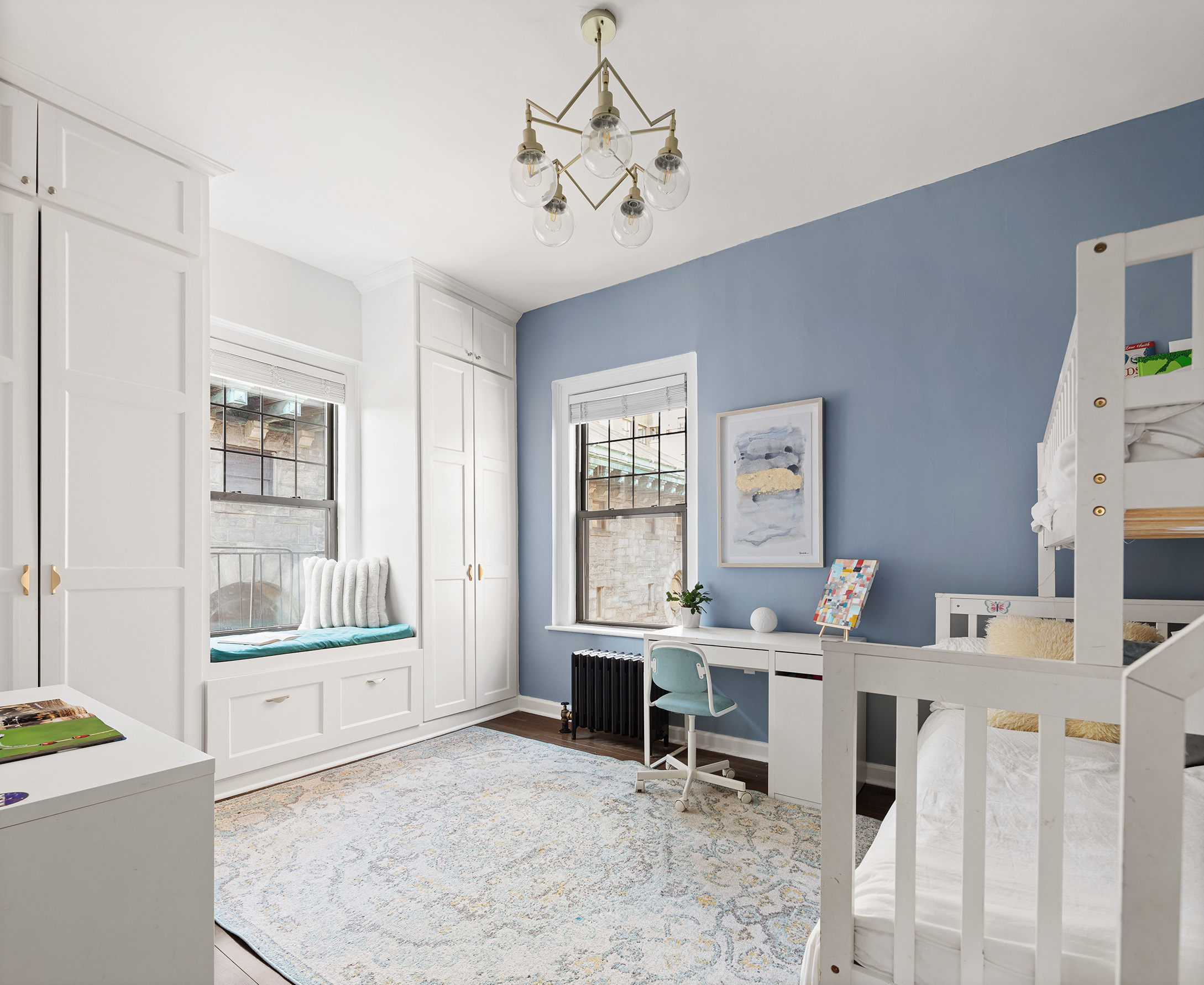 370 Central Park West, Unit PH601 Manhattan, NY 10025 - Photo 11 of 19 a living room with furniture a flat screen tv and a table