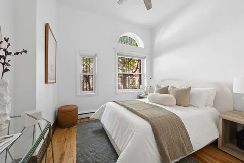 a bedroom with a bed and a couch