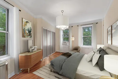 a bedroom with a bed and large window