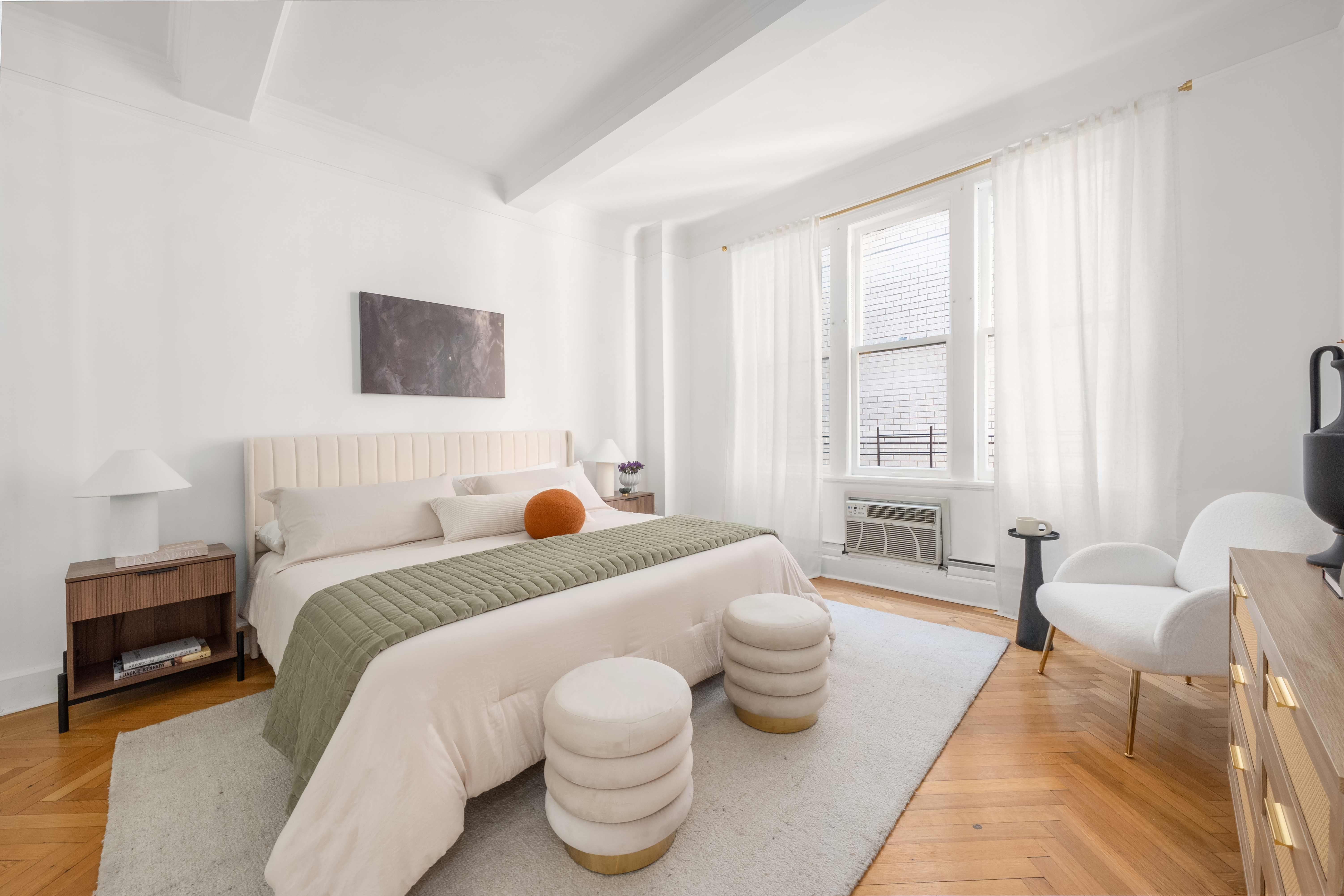 1060 Park Avenue, Unit 11A Manhattan, NY 10128 - Photo 6 of 12 a bed room with a bed and a couch