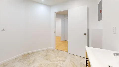 a view of a bathroom with sink and mirror