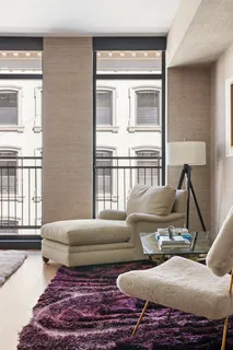 a living room with furniture and a window