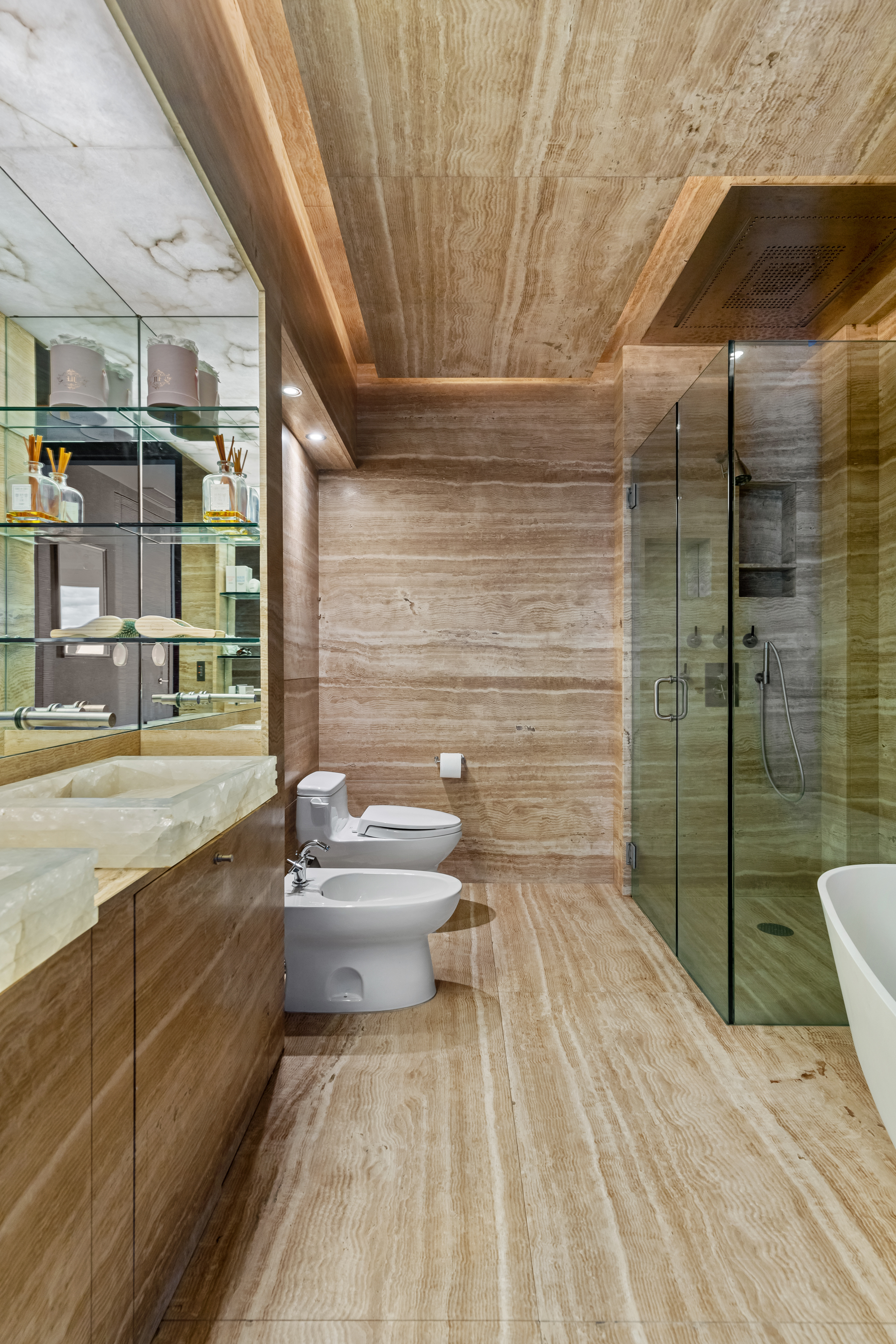 80 Columbus Circle, Unit 67B Manhattan, NY 10019 - Photo 9 of 16 a bathroom with a sink toilet and shower