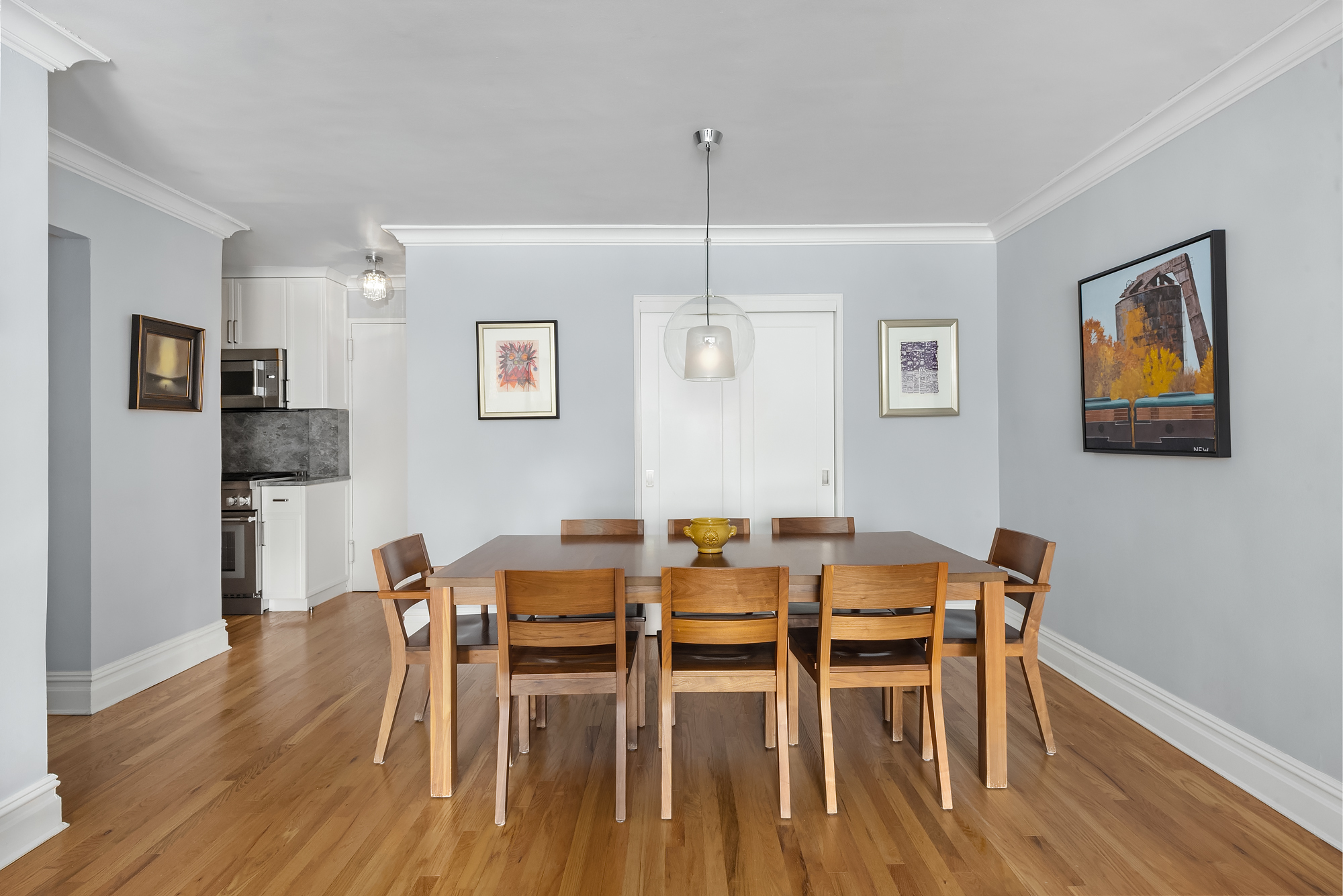 101 West 12th Street, Unit 8N Manhattan, NY 10011 - Photo 6 of 17 a view of a dining room with furniture and wooden floor