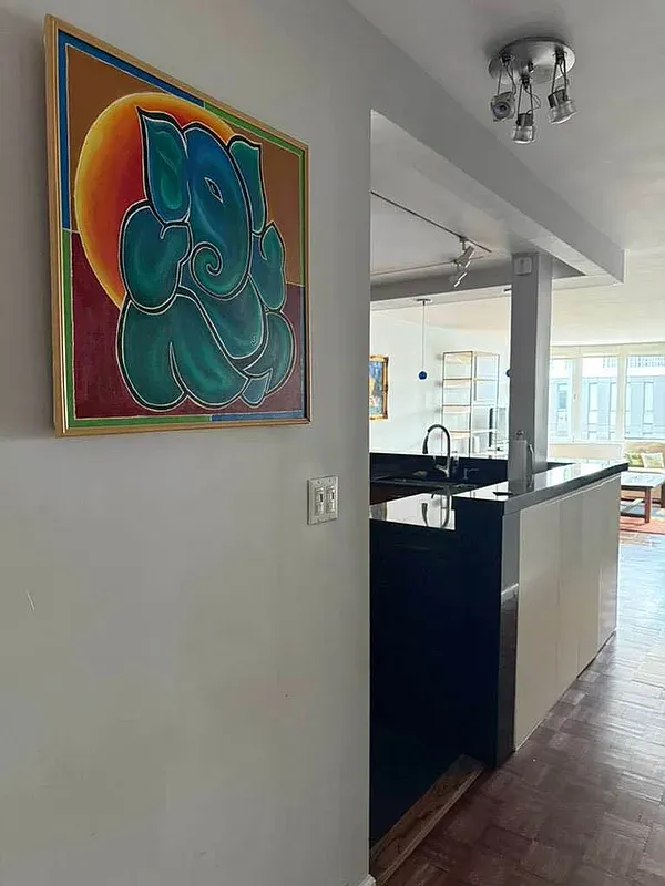 a kitchen with a refrigerator and a stove