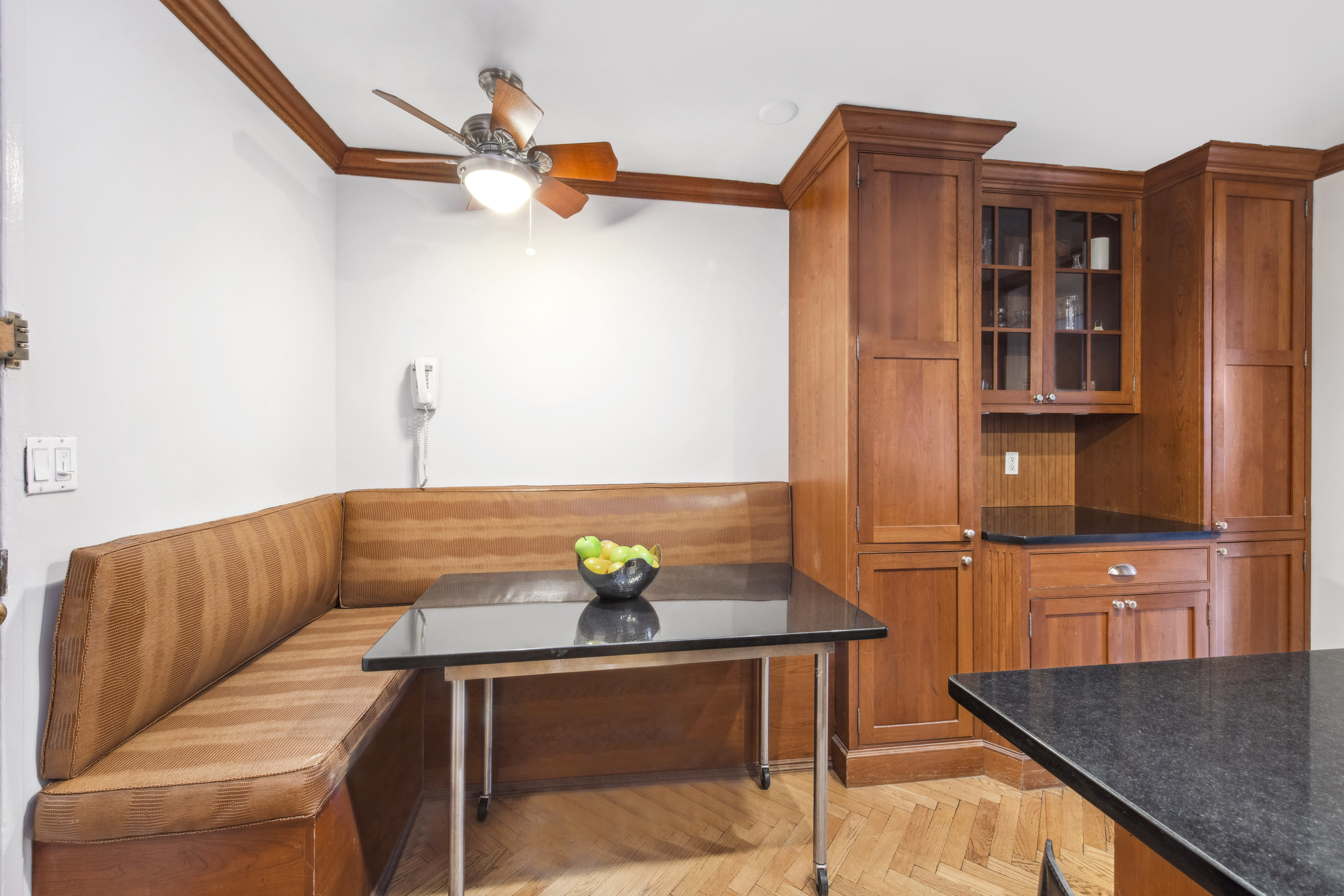 155 West 68th Street, Unit 404 Manhattan, NY 10023 - Photo 7 of 21 a living room with stainless steel appliances kitchen island granite countertop furniture and a rug