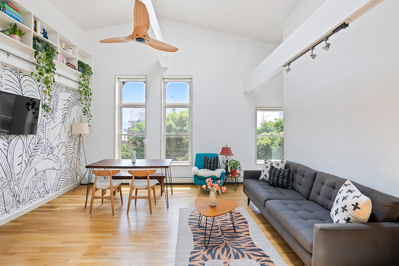 a living room with fireplace furniture and a flat screen tv