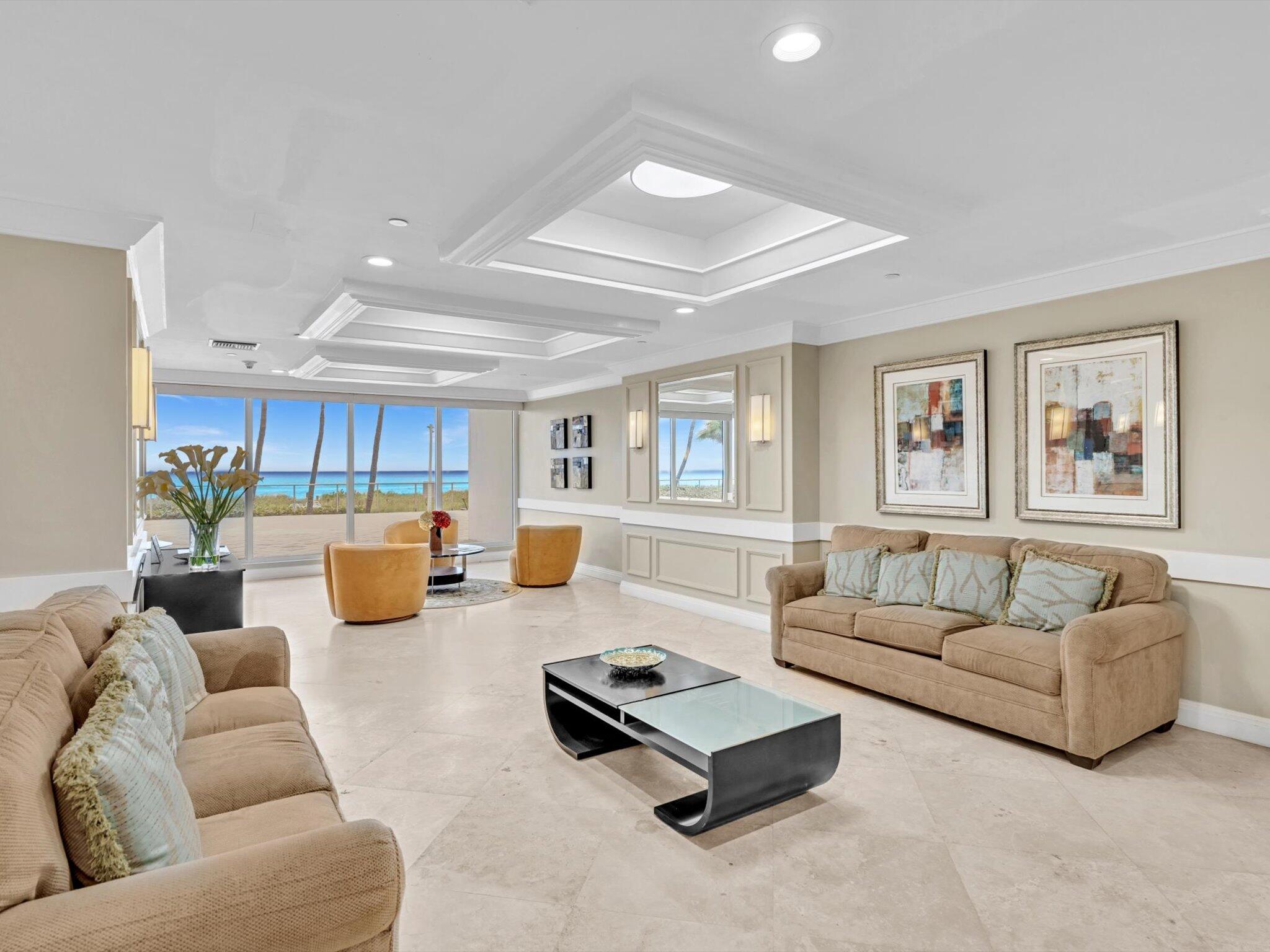 3000 South Ocean Boulevard, Unit 1504 Boca Raton, FL 33432 - Photo 50 of 64 a living room with furniture and a table