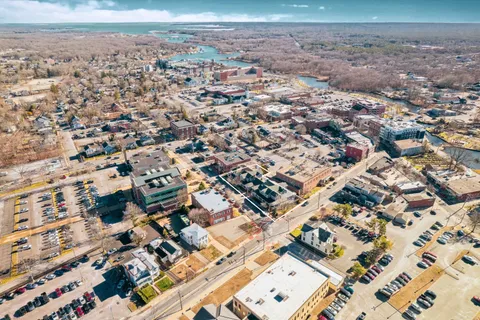 an aerial view of residential building with parking