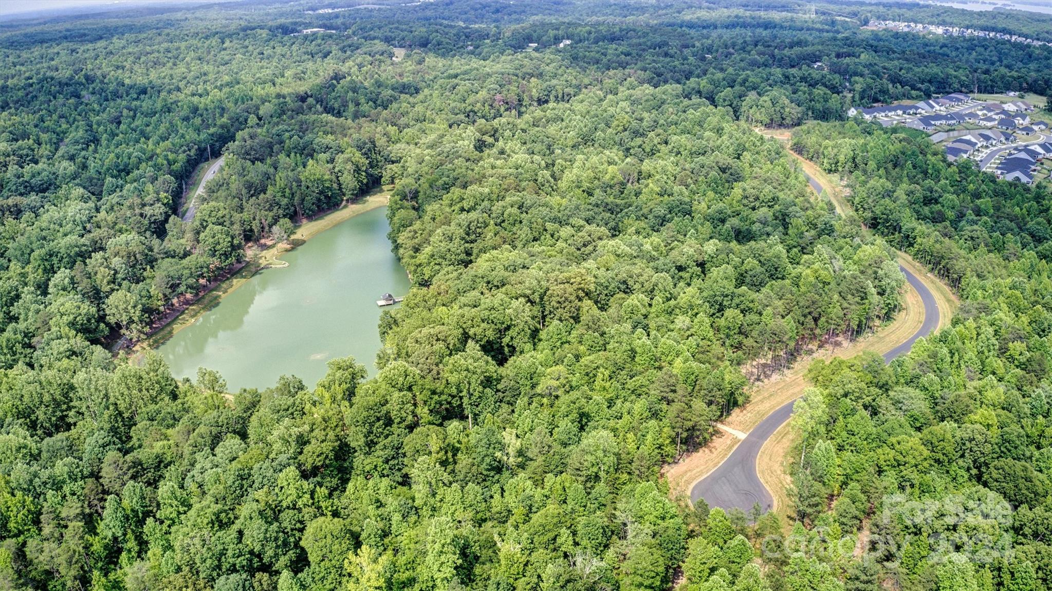 3 B Ventosa Drive Denver, NC 28037 - Photo 11 of 13 a view of a lake with a park