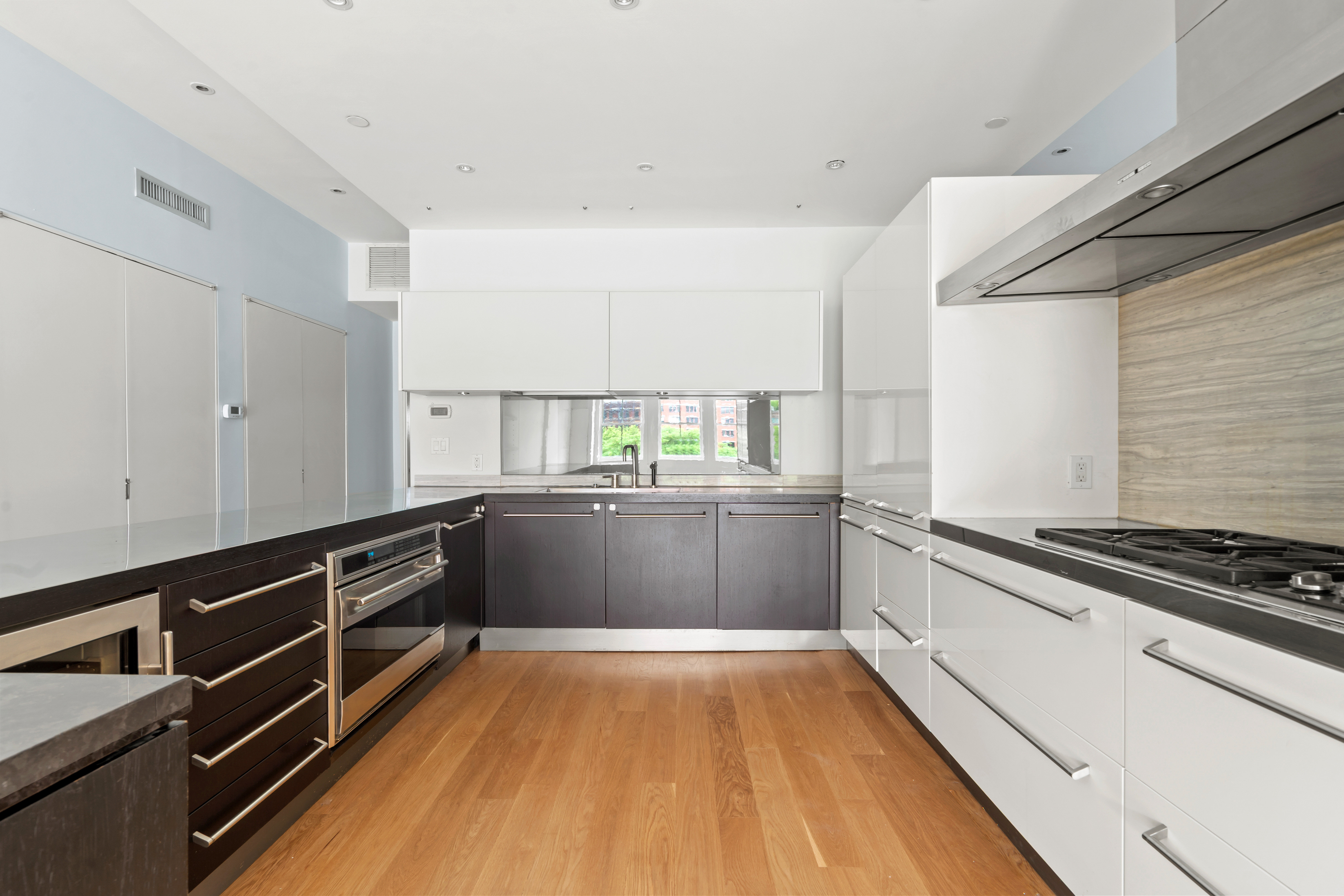 32 Laight Street, Unit 5 Manhattan, NY 10013 - Photo 15 of 31 a kitchen with granite countertop a stove and a sink