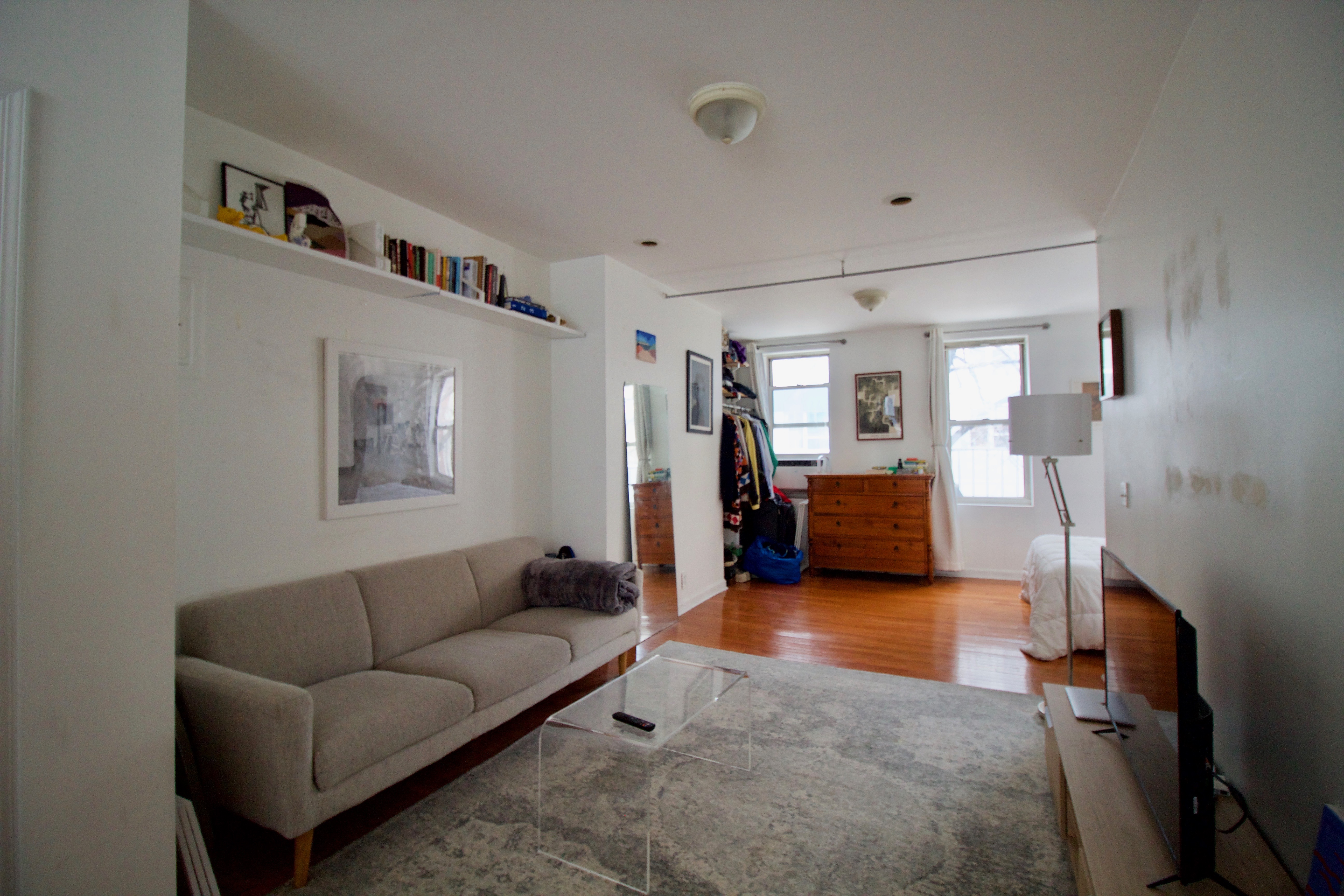 55 Duffield Street, Unit 3 Brooklyn, NY 11201 - Photo 2 of 14 a living room with furniture and a large mirror