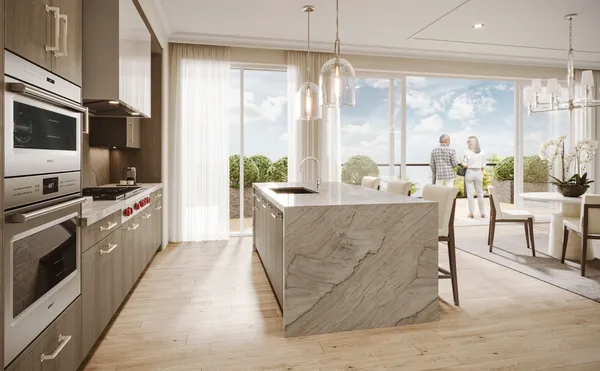 a kitchen with stainless steel appliances granite countertop a stove a sink and a refrigerator