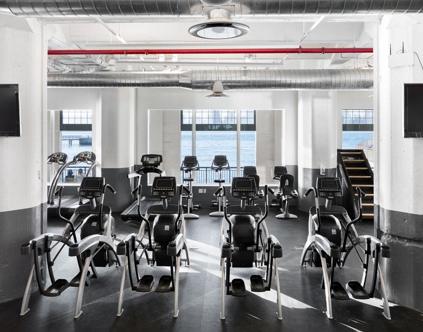 184 Kent Avenue, Unit B305 Brooklyn, NY 11249 - Photo 12 of 15 a gym with equipment