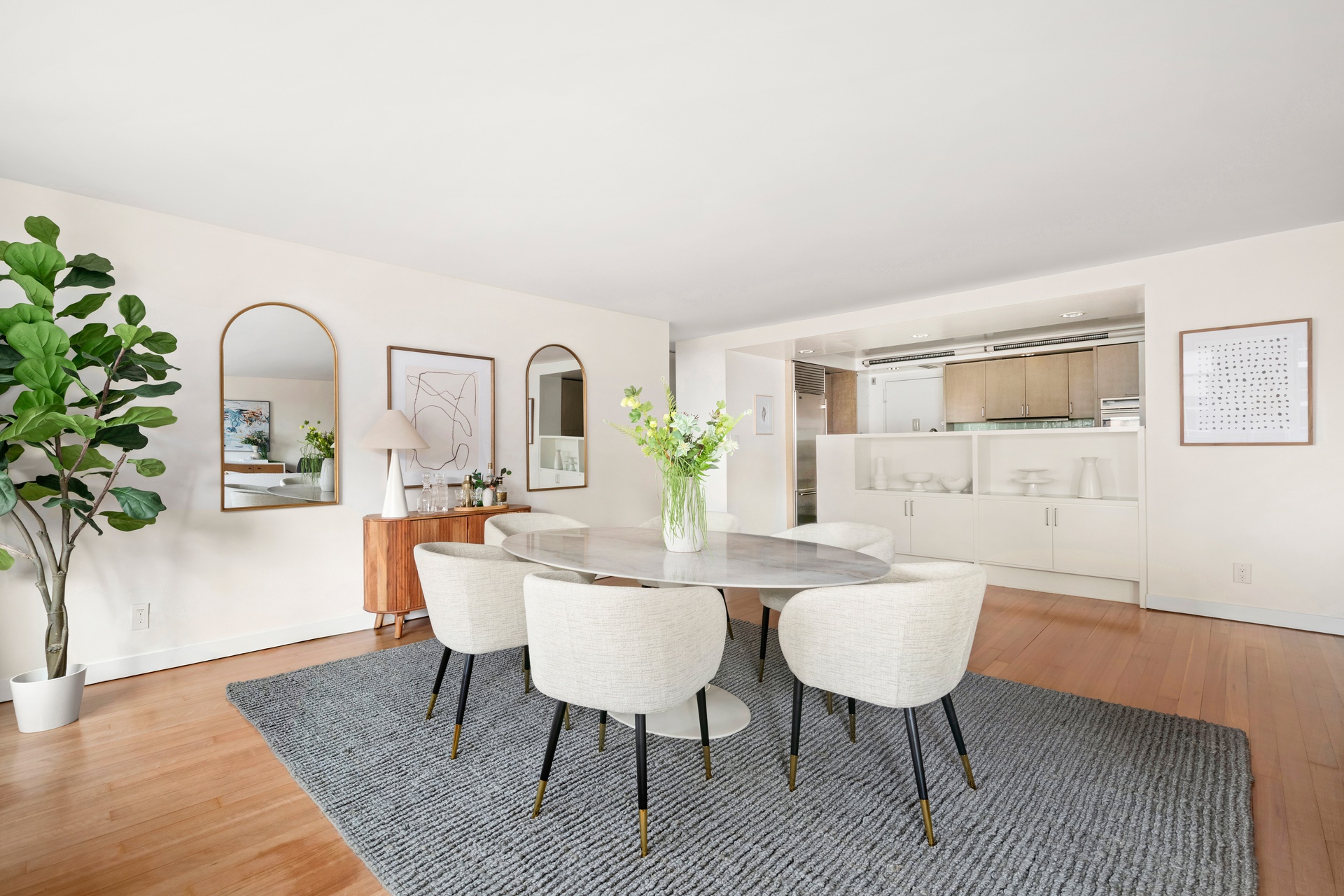 300 East 59th Street, Unit 2103 Manhattan, NY 10022 - Photo 3 of 14 a view of a dining room with furniture and wooden floor