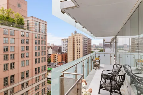 a view of balcony with furniture